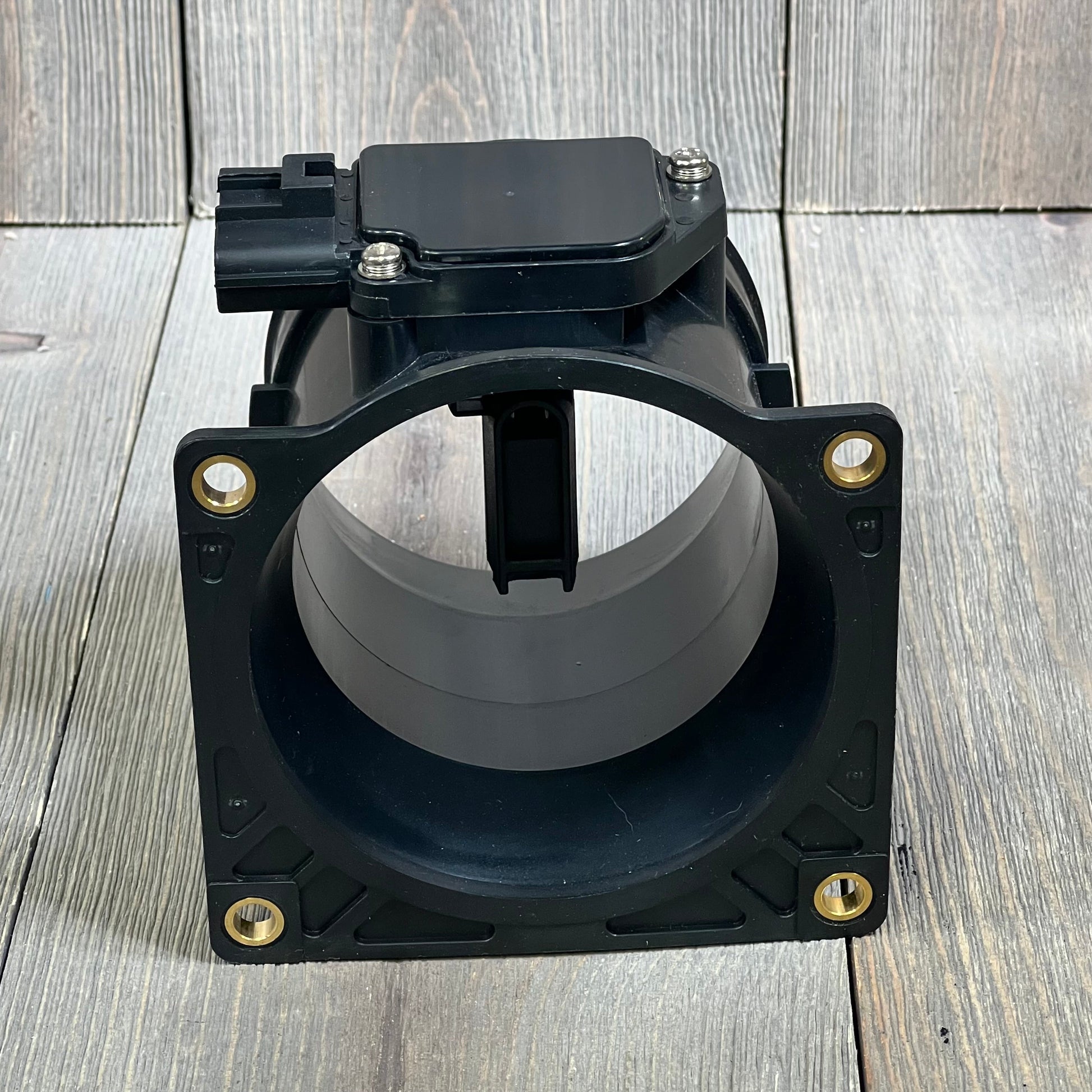Black Yezoauto Mass Air Flow Sensor compatible with Ford, Lincoln, Mercury, showing cylindrical design and mounting holes.