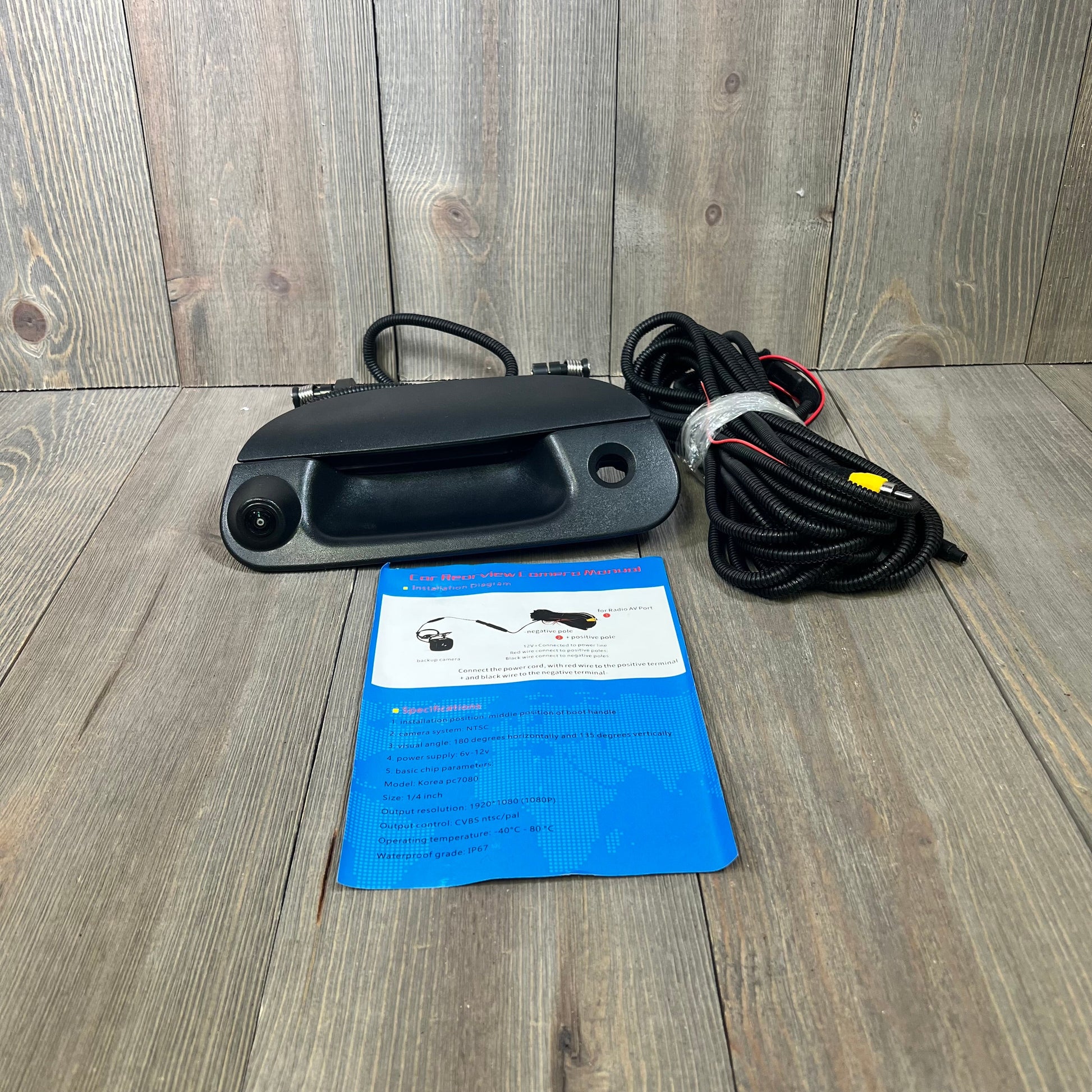 Backup camera tailgate handle with wiring and manual for Ford F-150, F-250, Explorer, Lobo, 1997-2007 models.