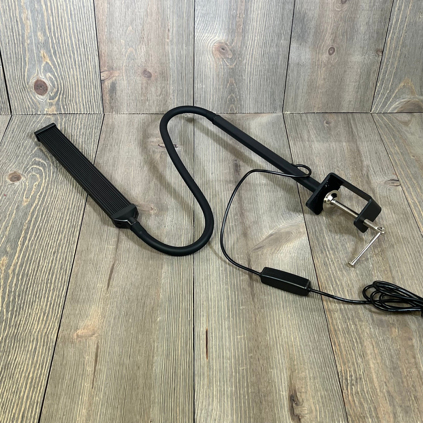 Black LIBORA LED desk lamp with flexible gooseneck and clamp, perfect for home office, study, or reading tasks.