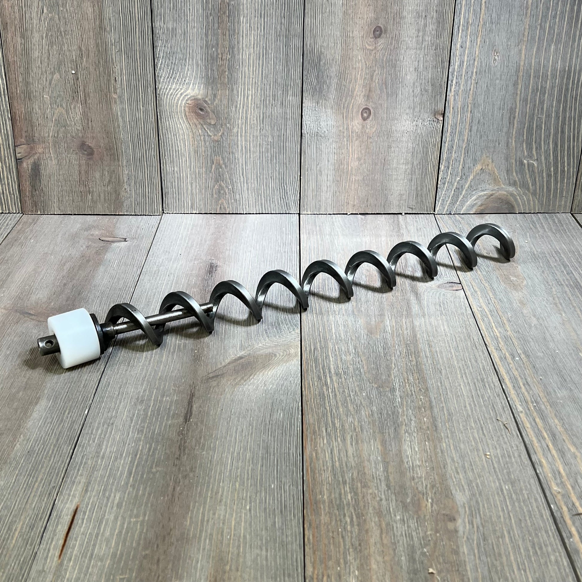 17-inch auger shaft screw push rod for Traeger pellet grills, featuring durable metal coils and a white motor bushing.
