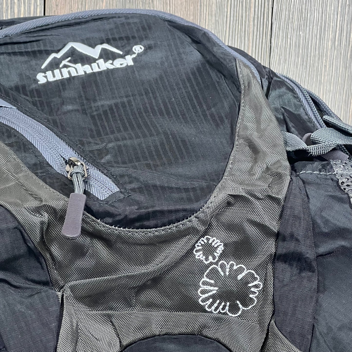 Lightweight sunhiker backpack with durable design, perfect for cycling and hiking, featuring a stylish black finish.