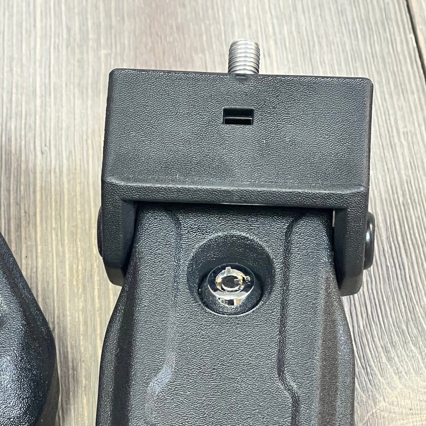 Black OEM hood latch for Jeep Wrangler JL JLU Gladiator JT, featuring a locking mechanism with key, close-up view.