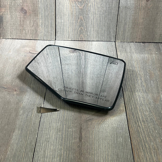 Passenger side heated mirror glass with plastic backing, featuring "objects in mirror" text, ideal for vehicle replacement.