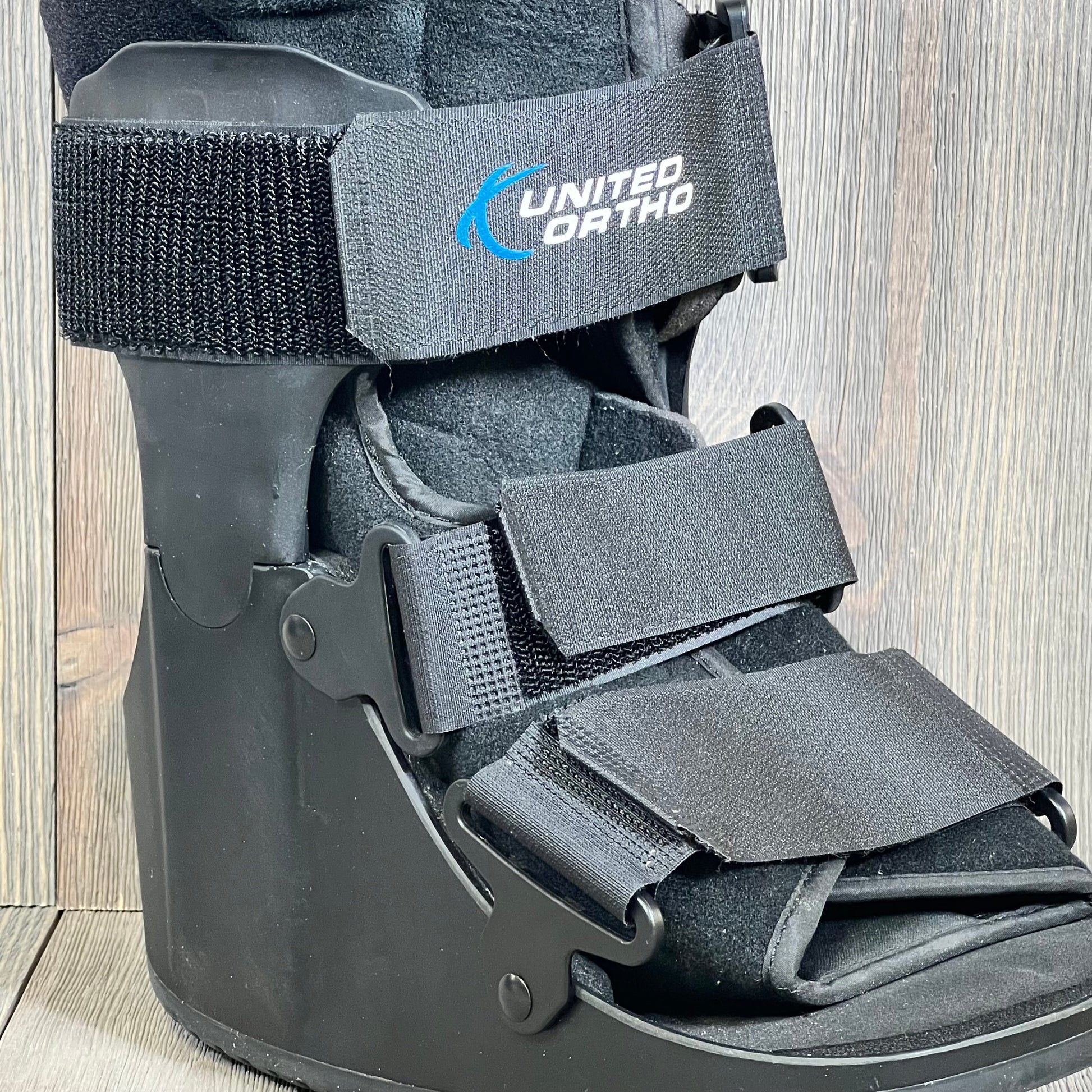 Extra small black United Ortho USA14111 air cam walker boot with adjustable straps for fracture support.