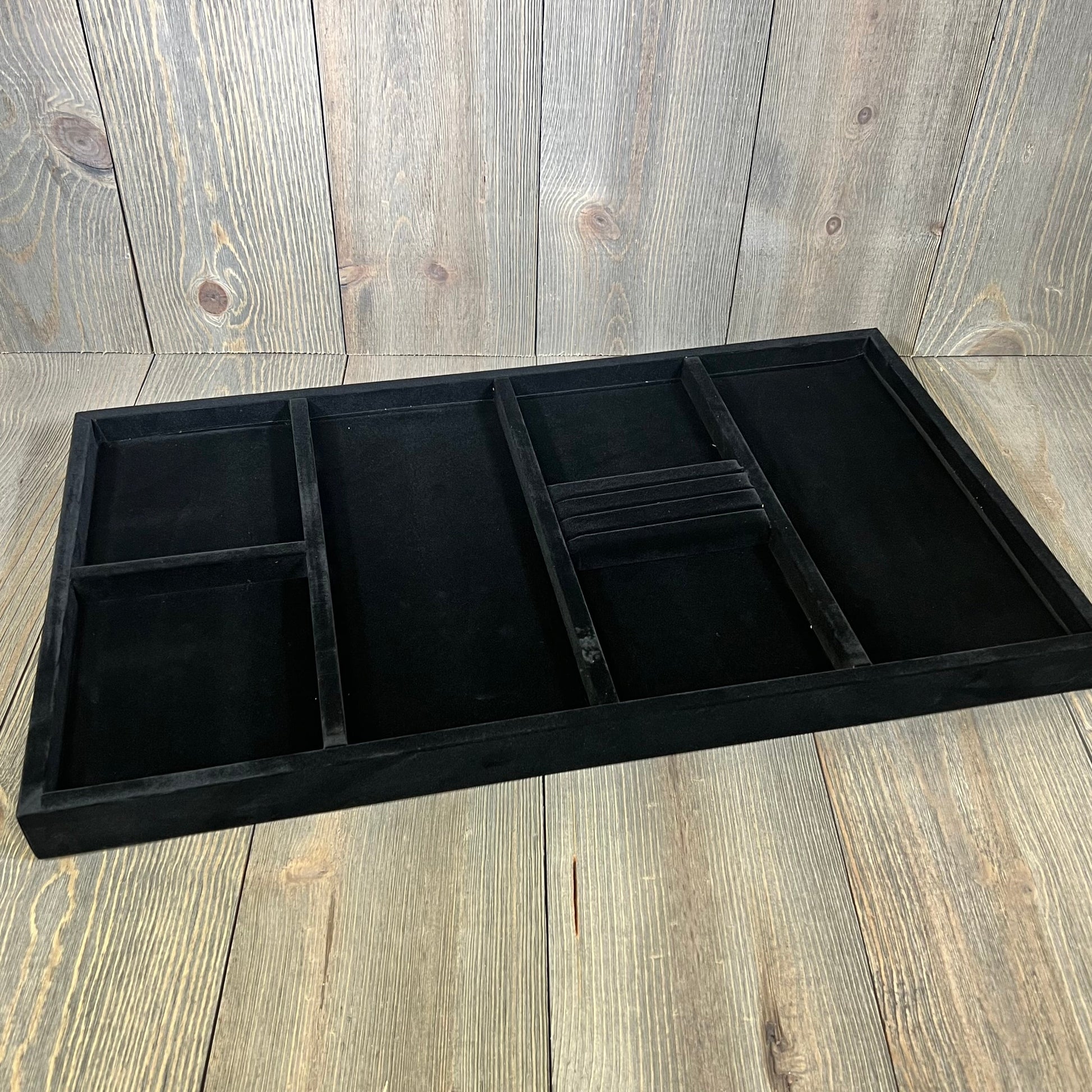 Plush black ClosetMaid SuiteSymphony velvet jewelry organizer with compartments for necklaces, earrings, bracelets, and more.