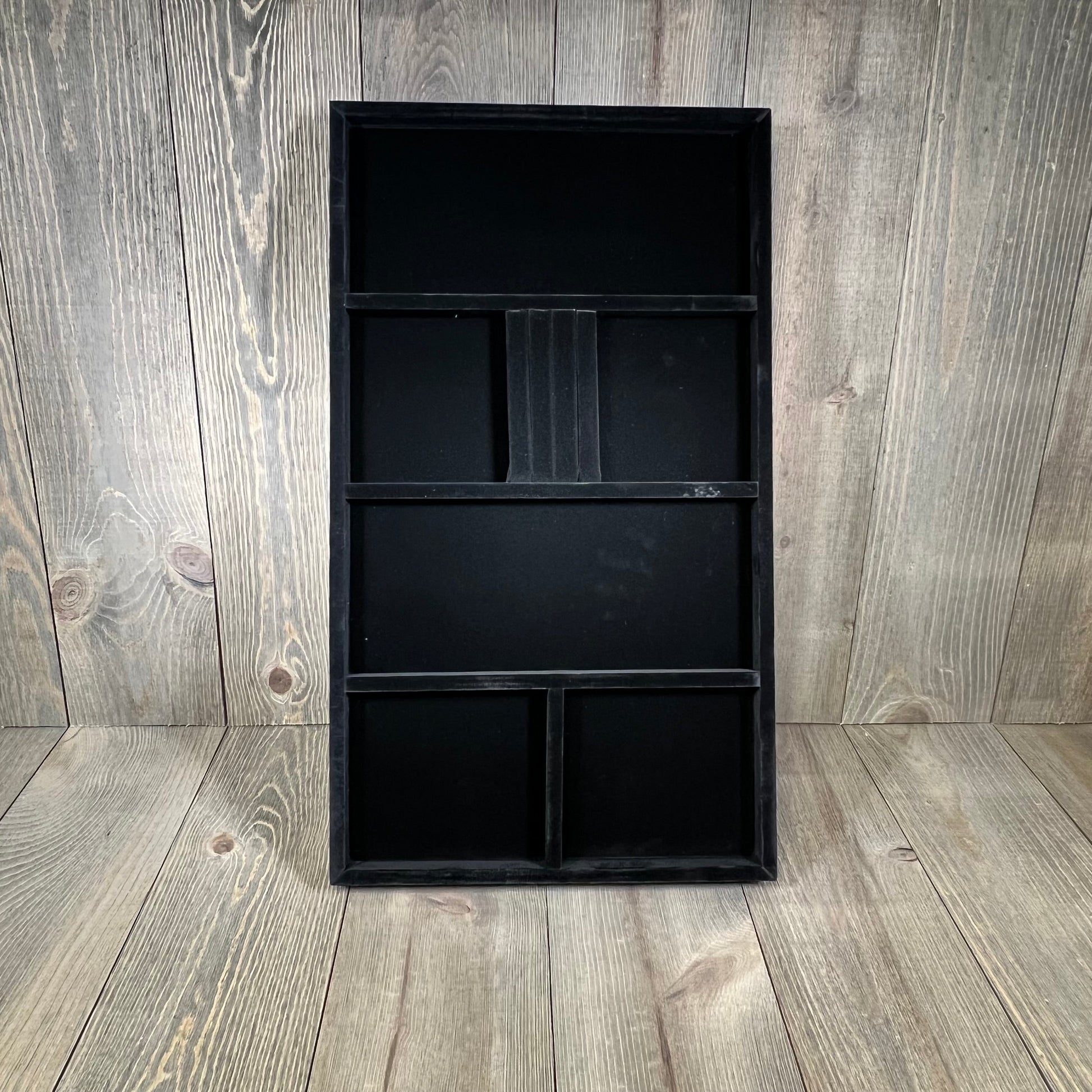 Plush black jewelry tray insert for necklaces, earrings, bracelets, and rings, enhancing elegance and organization.