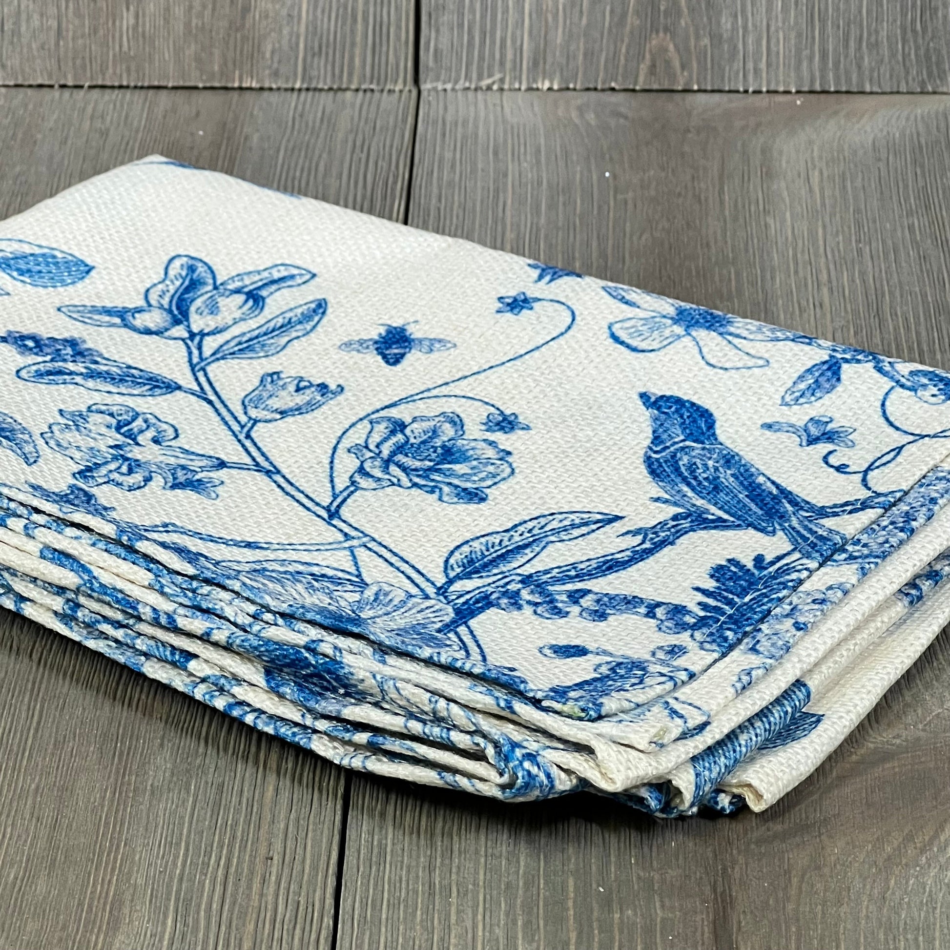 Blue and white floral and bird sketch table runner, perfect for seasonal decor in spring and fall, measuring 13x72 inches.