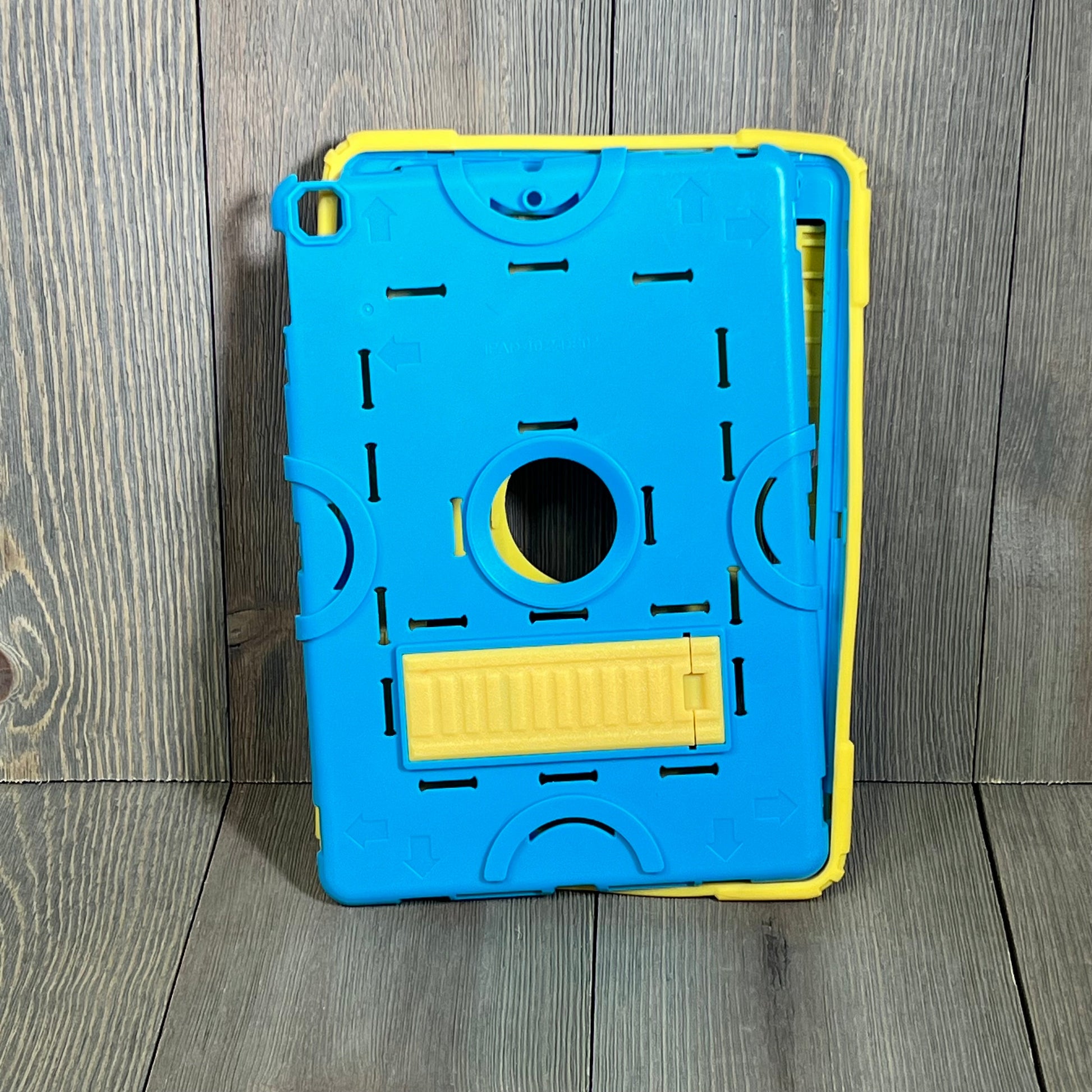 Heavy duty ZoneFoker iPad case in blue and yellow, featuring a rugged design with a built-in kickstand for kids' protection.