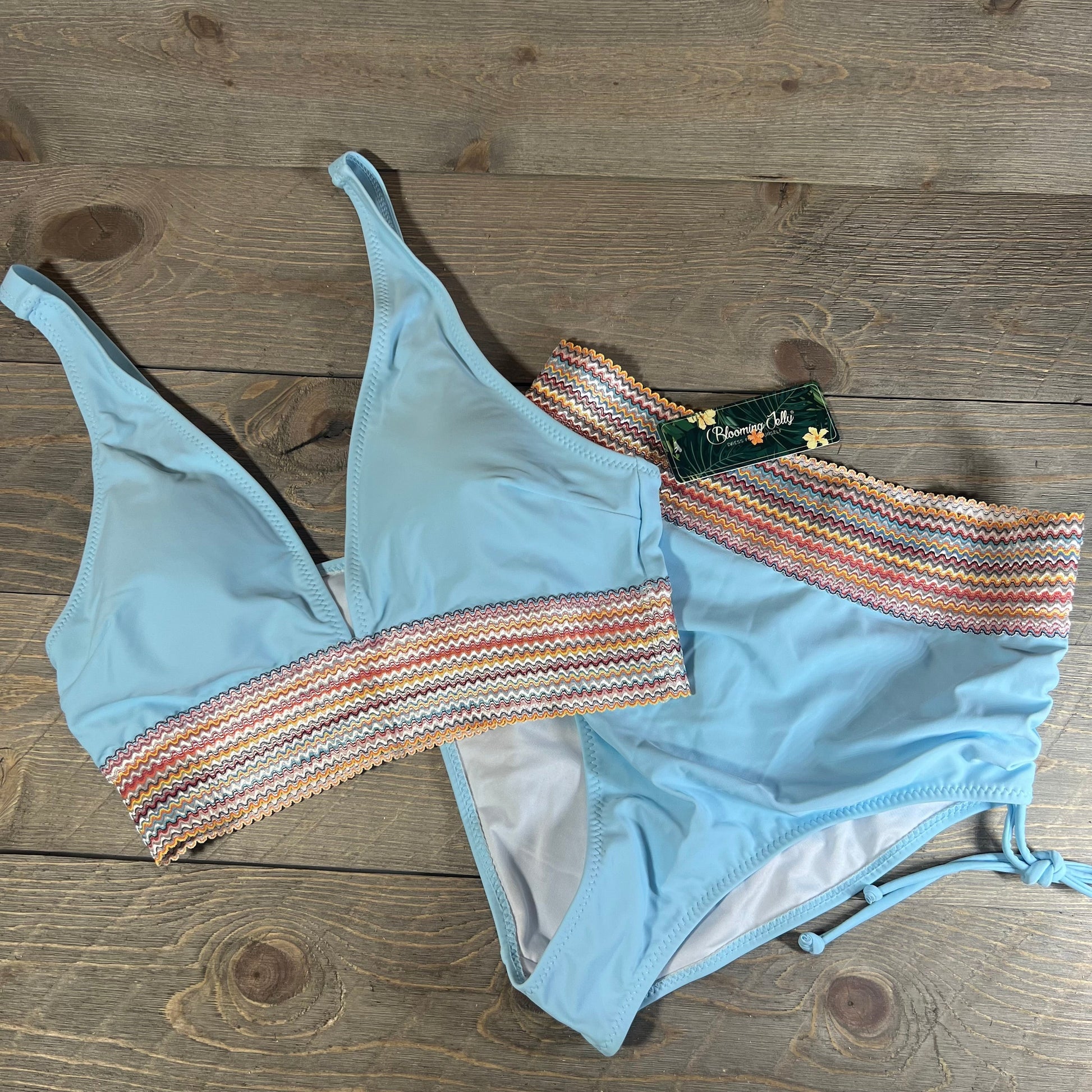 Blue high waisted bikini set with colorful zigzag trim, featuring tummy control, size M.