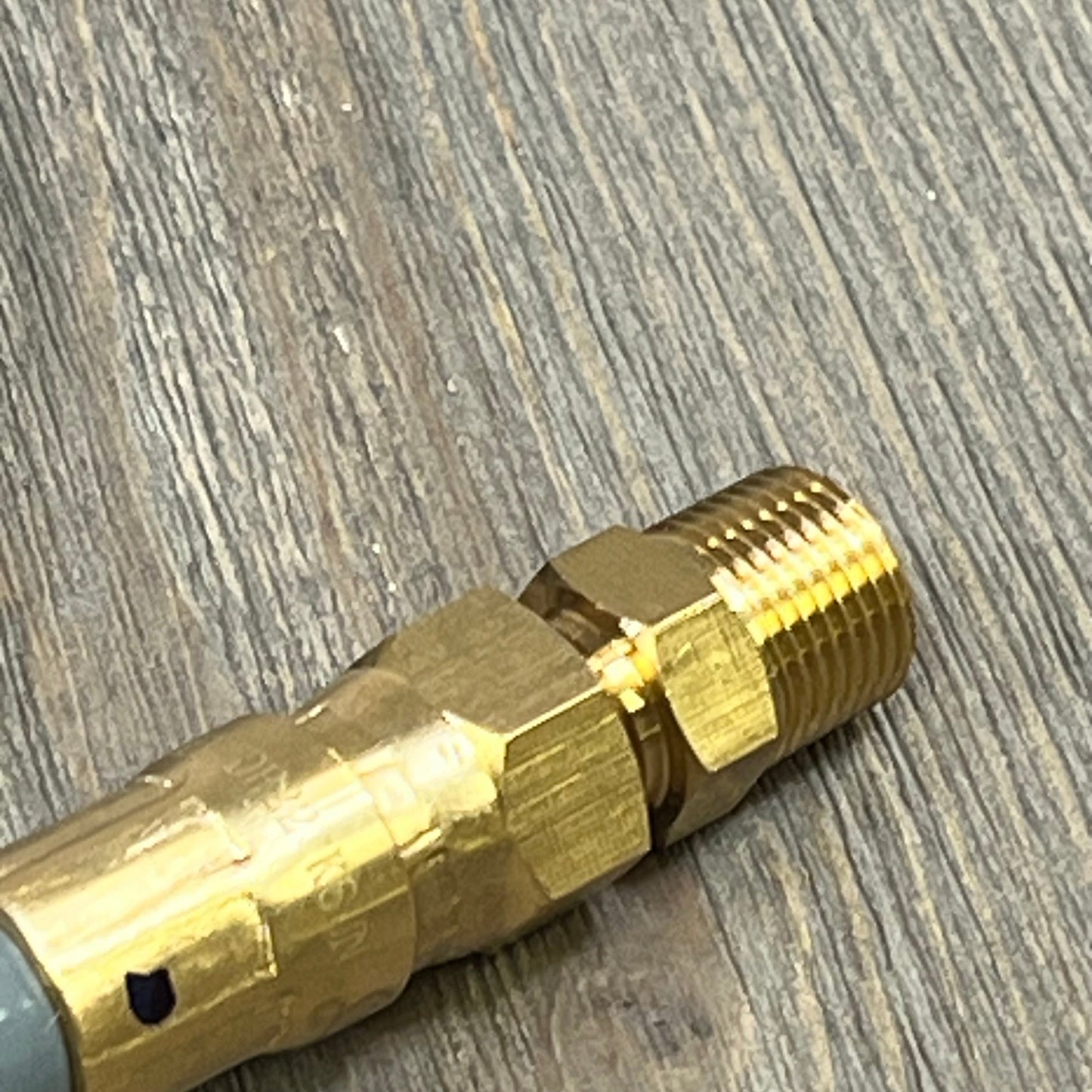 Gold quick connect fitting on the GasSaf 6FT 3/8" ID natural gas hose, ideal for Weber grills and patio heaters.