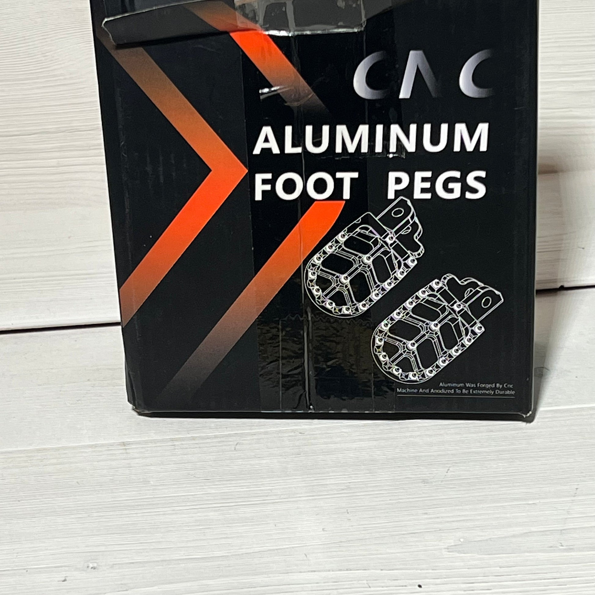 Black box packaging of AnXin Aluminum Motorcycle Foot Pegs for PW50, PW80, Pit Dirt Bike, featuring reinforced design.