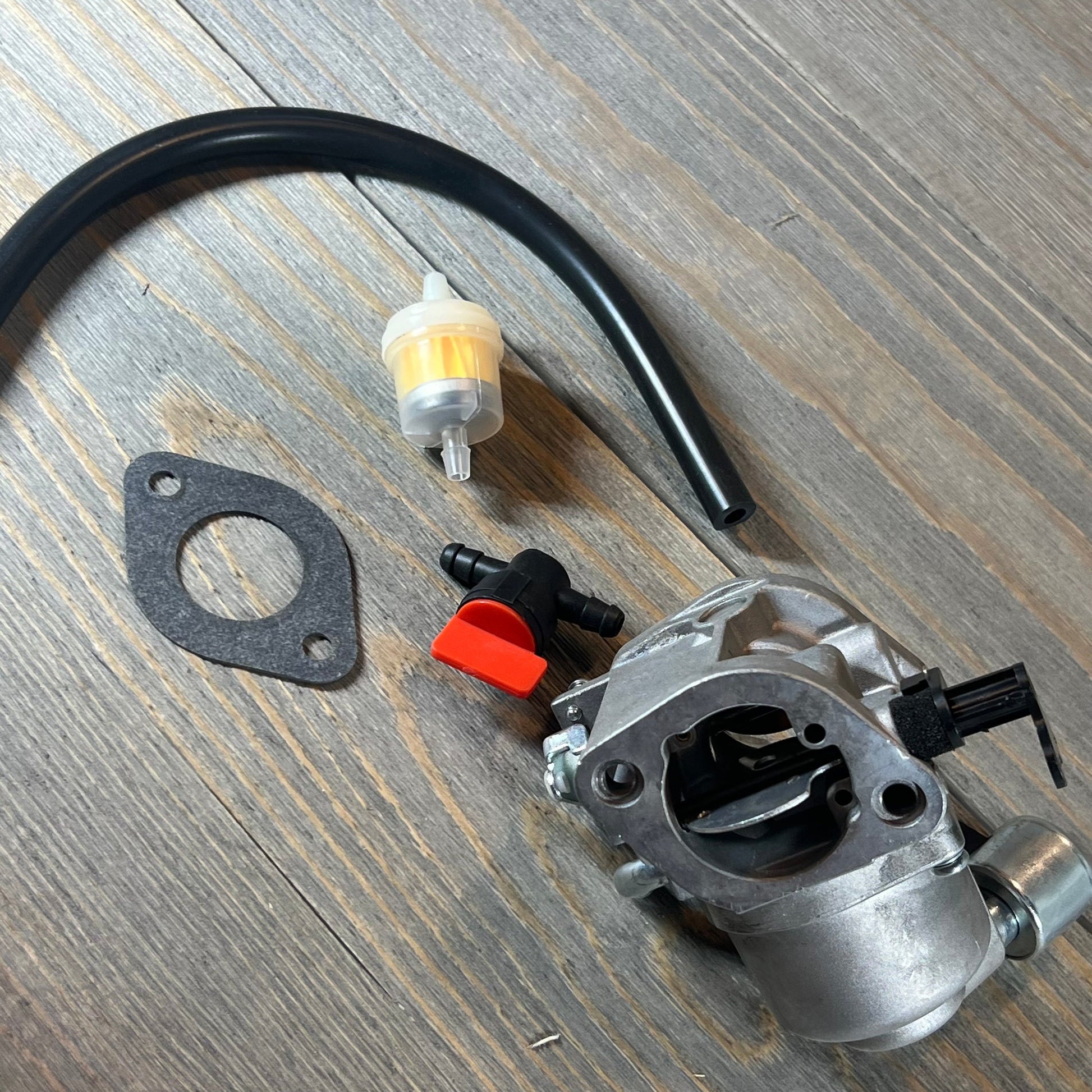 Carburetor kit for 40N777 Intek Engine Mower with gasket, hose, and filter included.