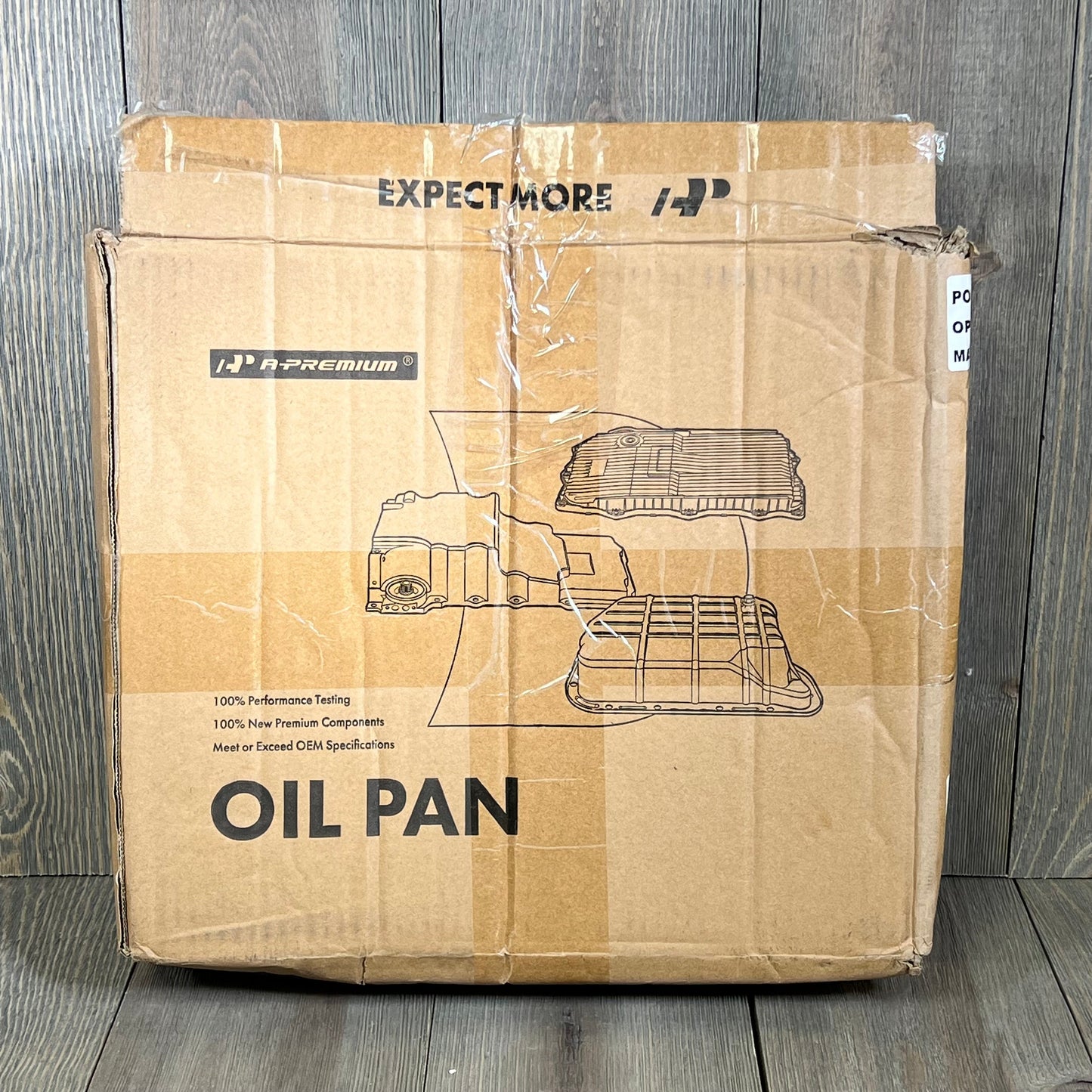 Cardboard box packaging for Premium Transmission Oil Pan Sump, showing product illustration and features for Toyota models.