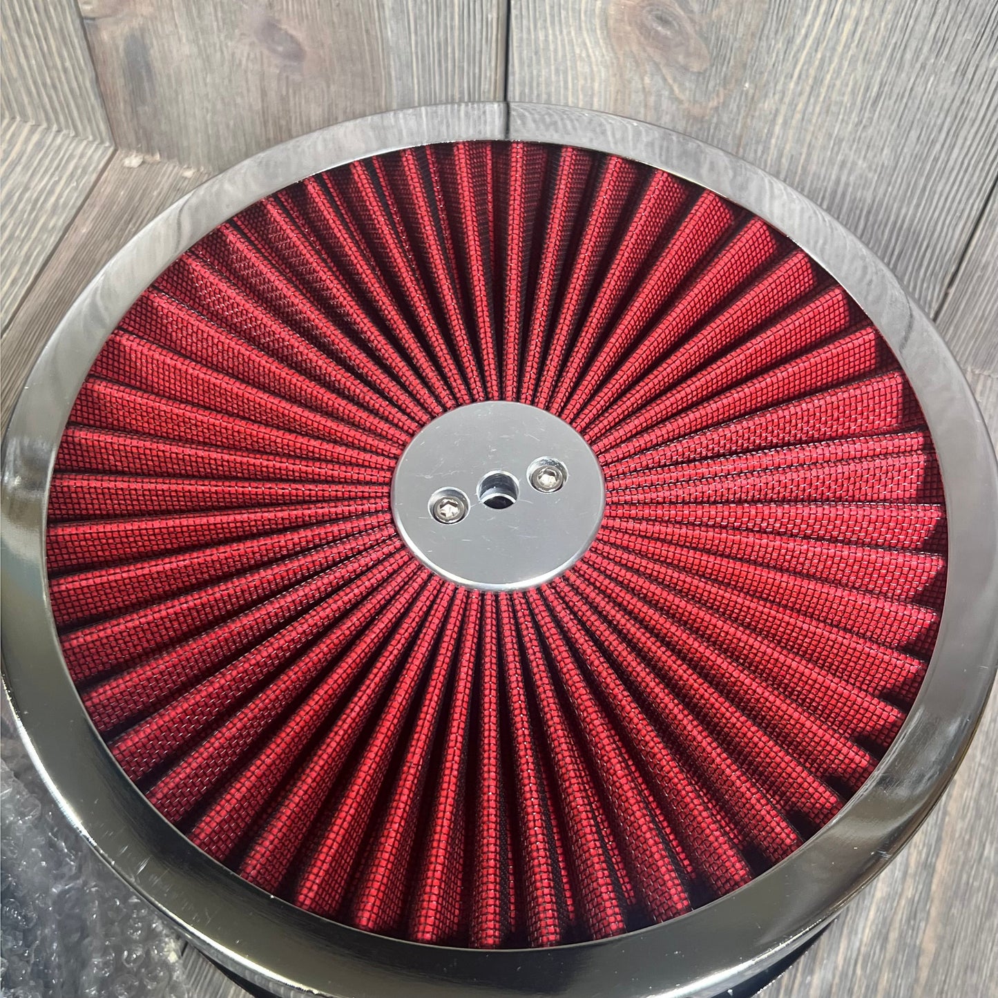 Red 9"x3" air filter assembly kit for V8 engines, featuring a washable, reusable design with mounting stud and wing nut.