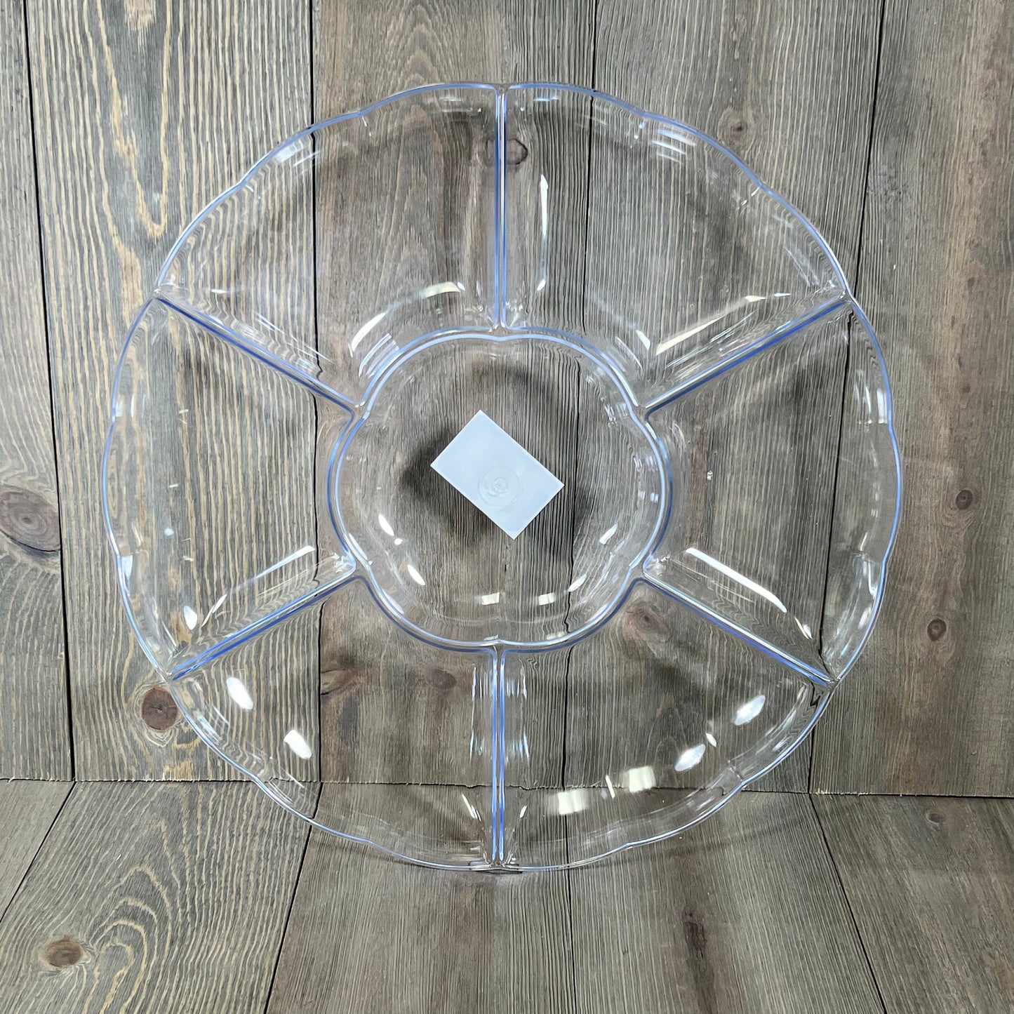 Clear hard plastic round serving tray with seven sections, perfect for parties, 16-inch diameter, three-count set.