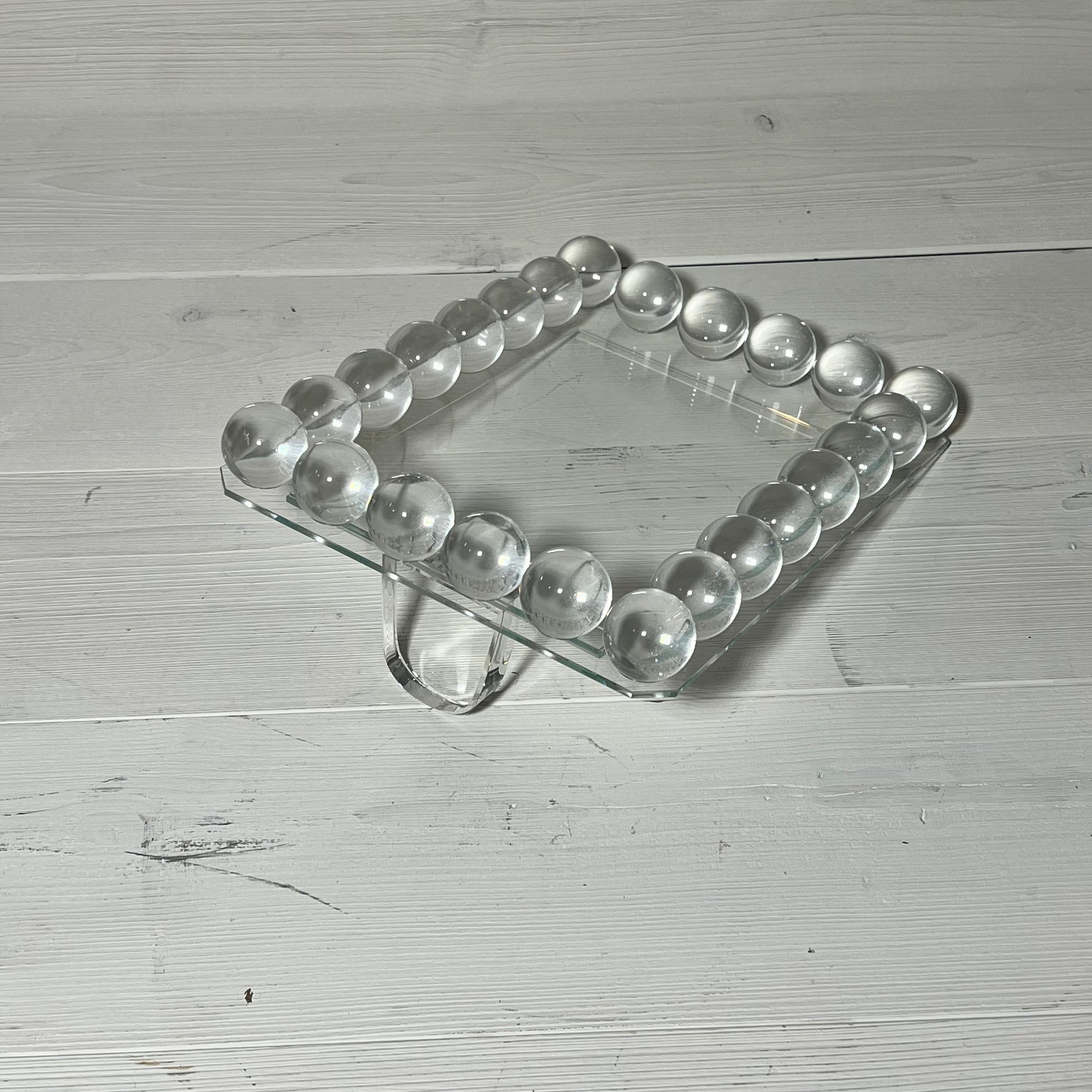 Clear bubble crystal picture frame with 24 decorative balls, ideal for elegant vertical display on office desk.