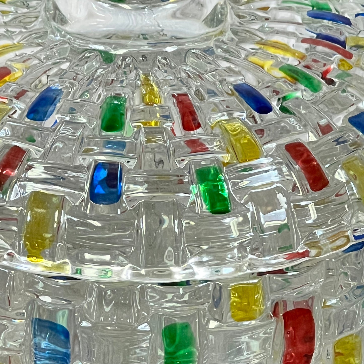 Colorful crystal candy jar with vibrant lid details, perfect for festive treats and holiday decor. Glass container, 24 oz capacity.