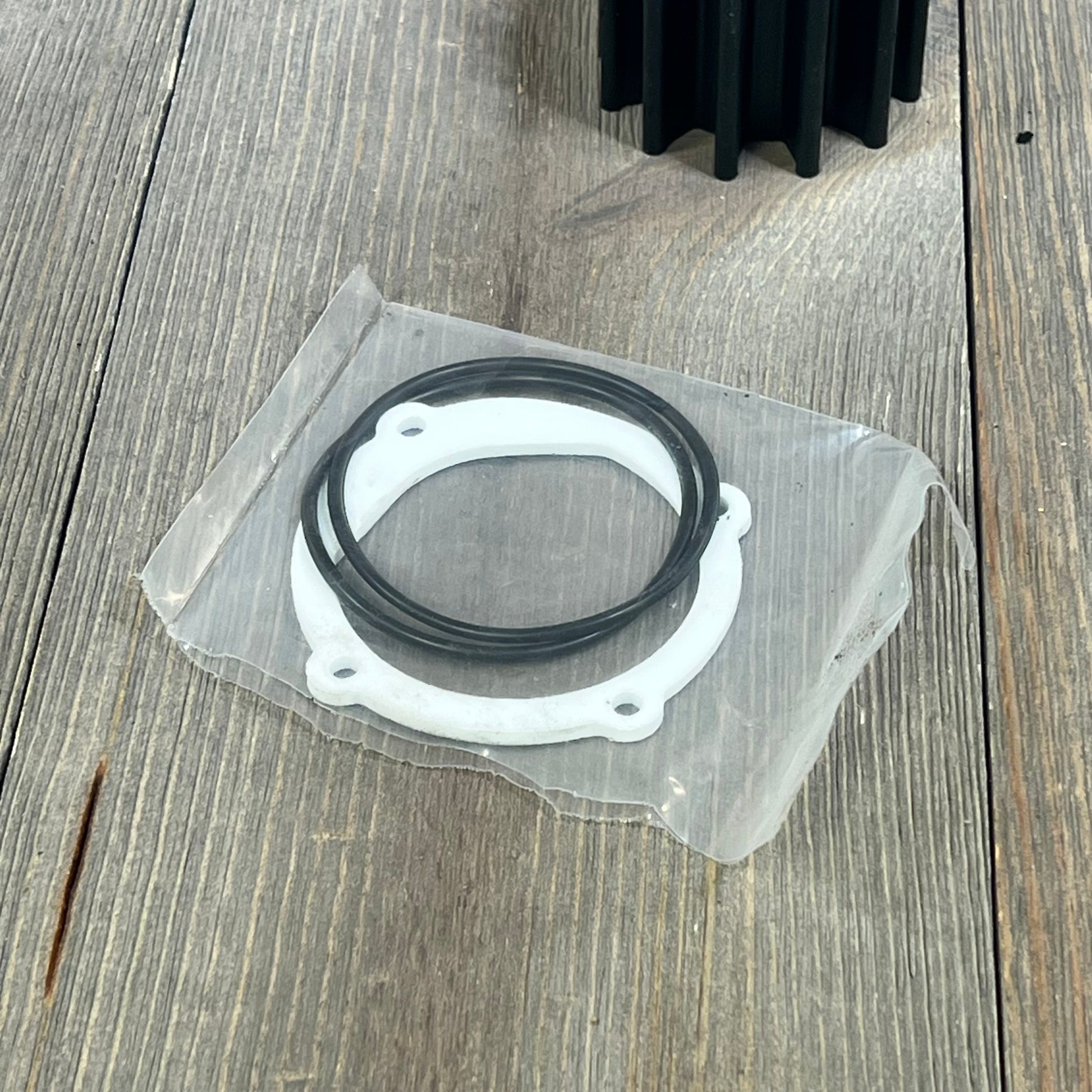 Water pump impeller repair kit with gaskets and O-rings, compatible with Johnson and Yanmar marine engines.
