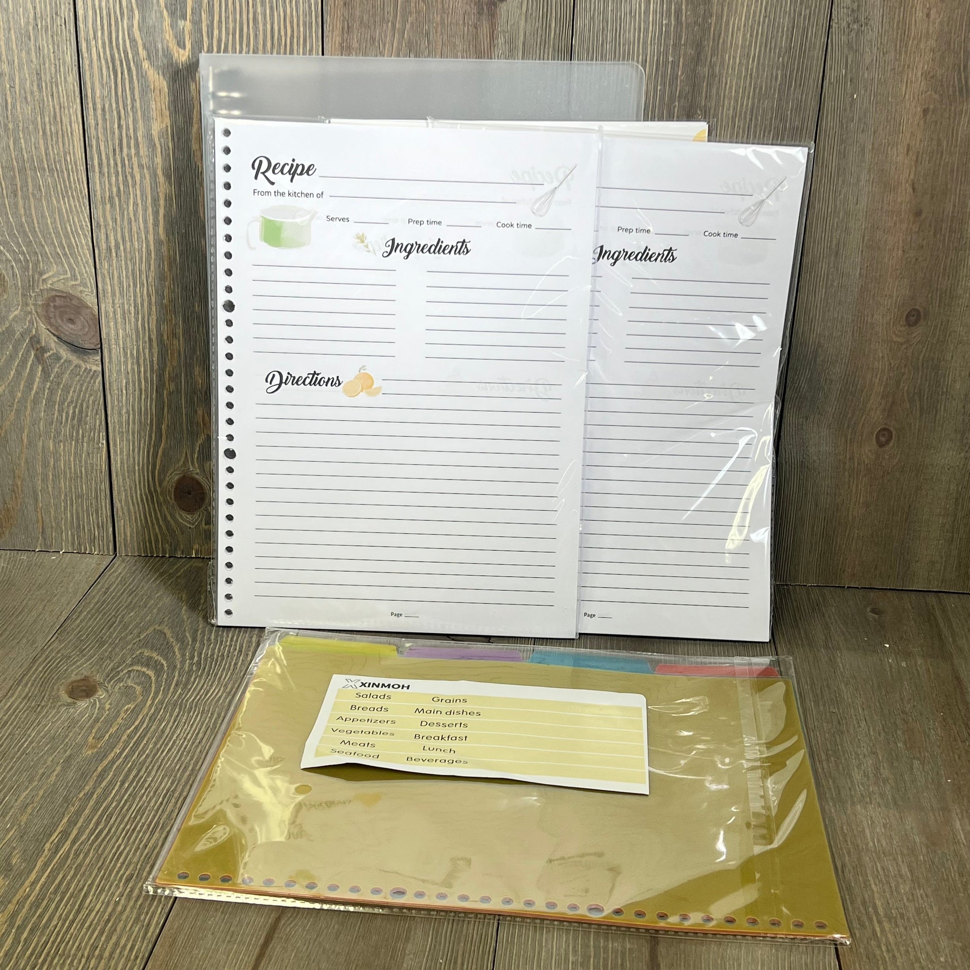 Blank recipe pages and colorful dividers for 8.5" x 11" customizable recipe book, perfect for organizing personal recipes.