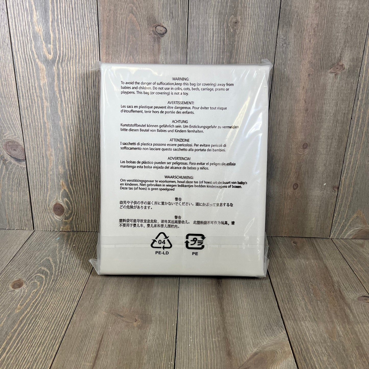 Beige blackout curtains packaging, showcasing safety instructions; ideal for room darkening in living rooms and bedrooms.