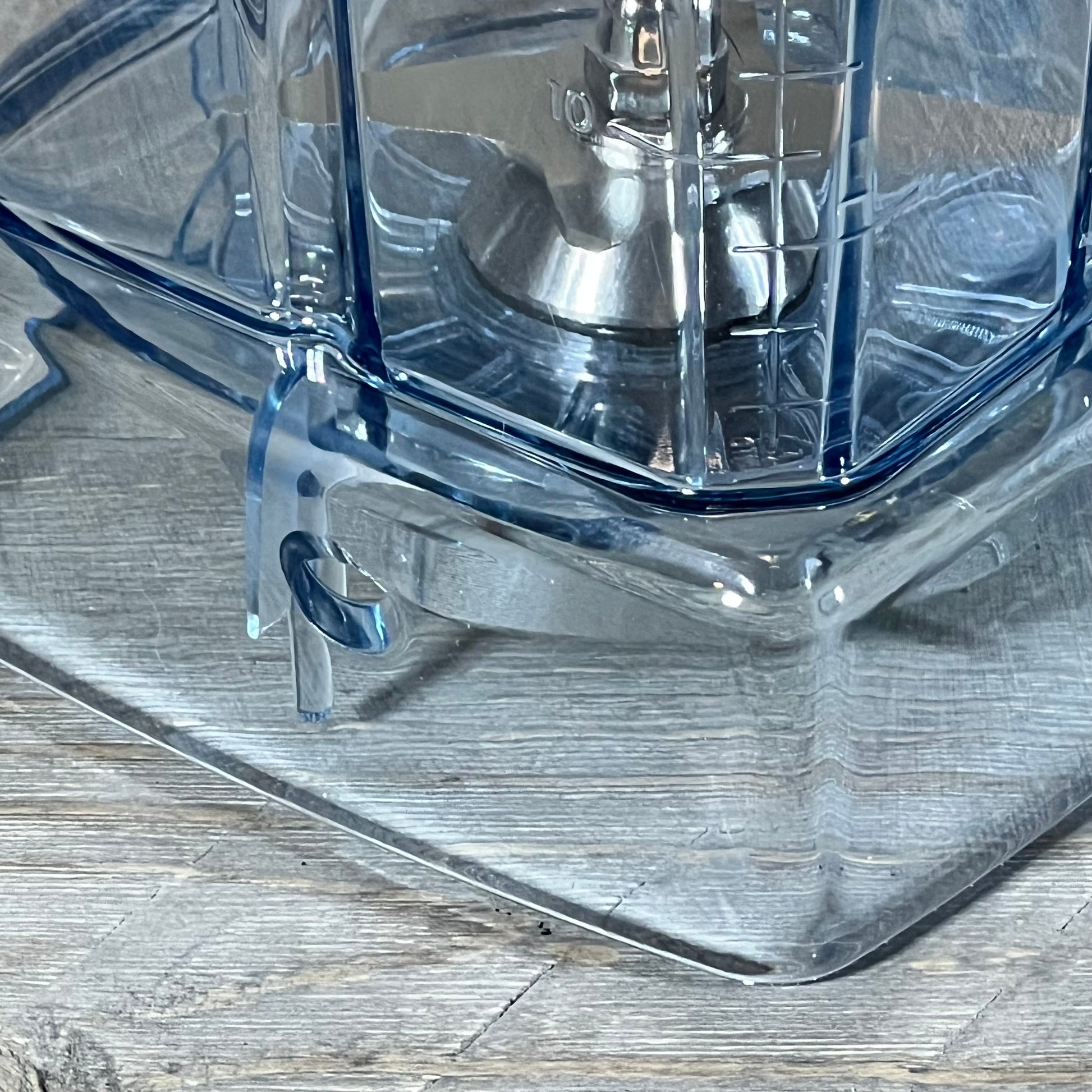 Close-up of a 64oz blender pitcher base for Vitamix models, highlighting sturdy construction and clear design.