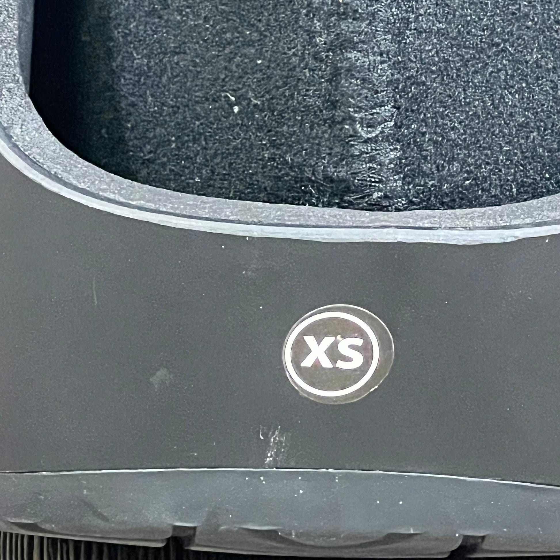 Extra small United Ortho USA14111 black air cam walker boot, close-up of durable material and XS size label.