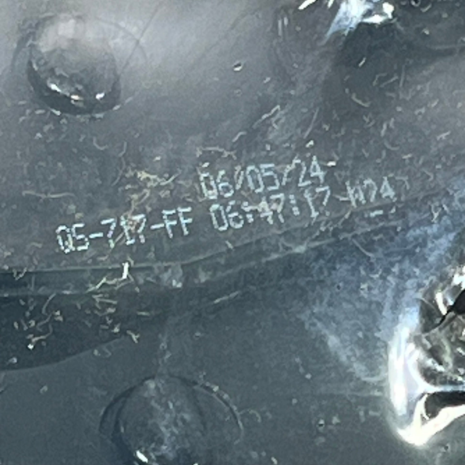 Close-up of the Wagner QuickStop ZD711 brake pad surface for 2003 Ford F-150, showcasing detailed manufacturing code.