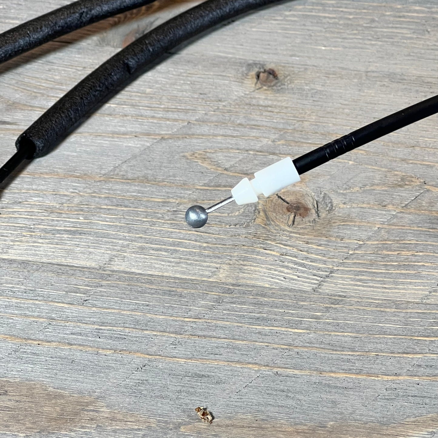 Close-up of a door lock actuator cable for 2013-2019 Hyundai Santa Fe, showing detailed connector and latch assembly.