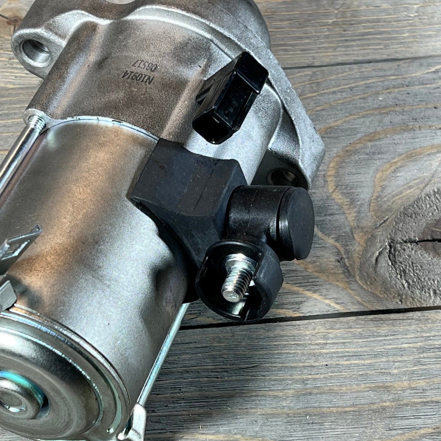 Close-up of a starter motor compatible with Honda Accord 2013-2017, featuring durable metal construction.