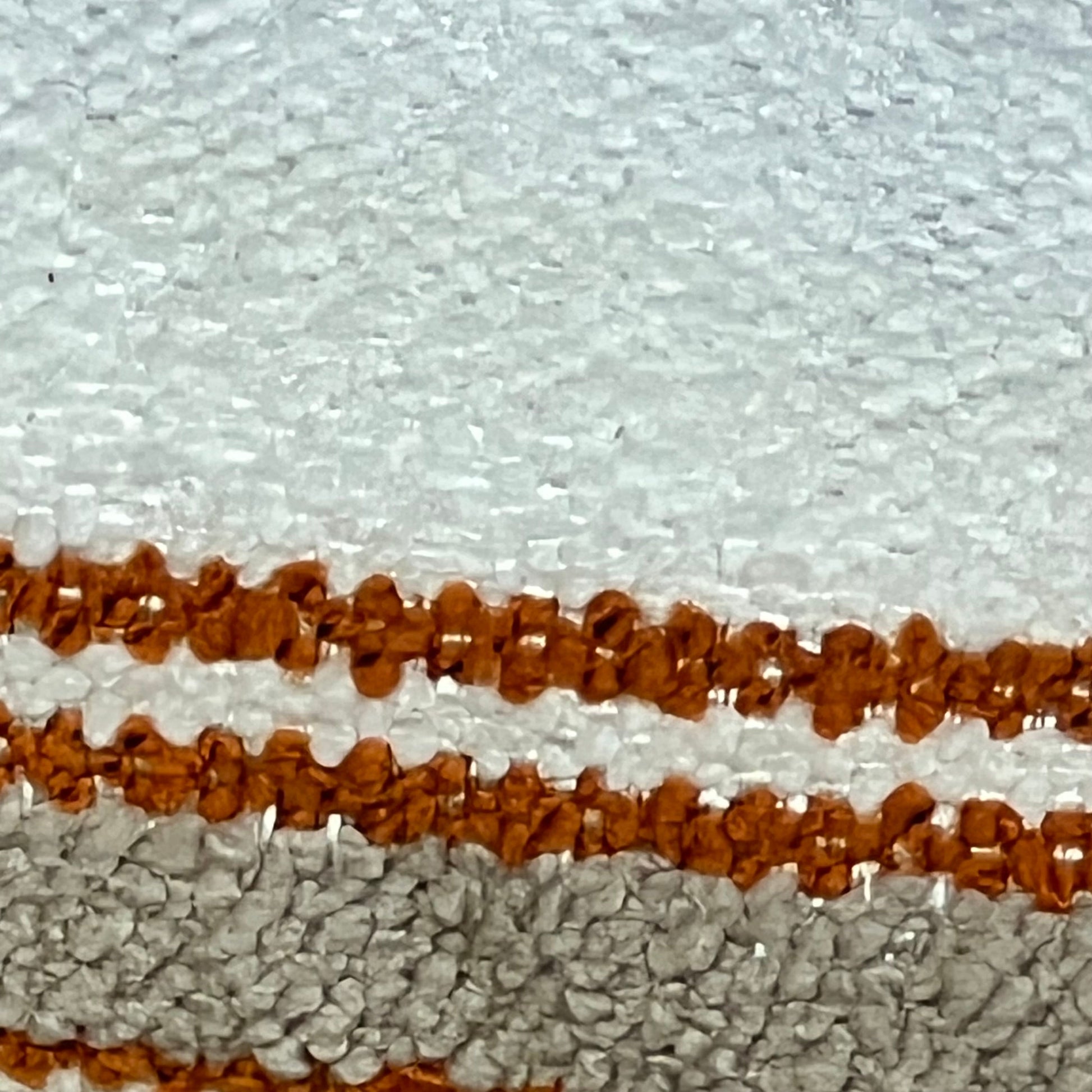 Close-up of Wosendy Boho Pillow Cover showcasing soft striped texture in earthy tones, perfect for farmhouse decor.