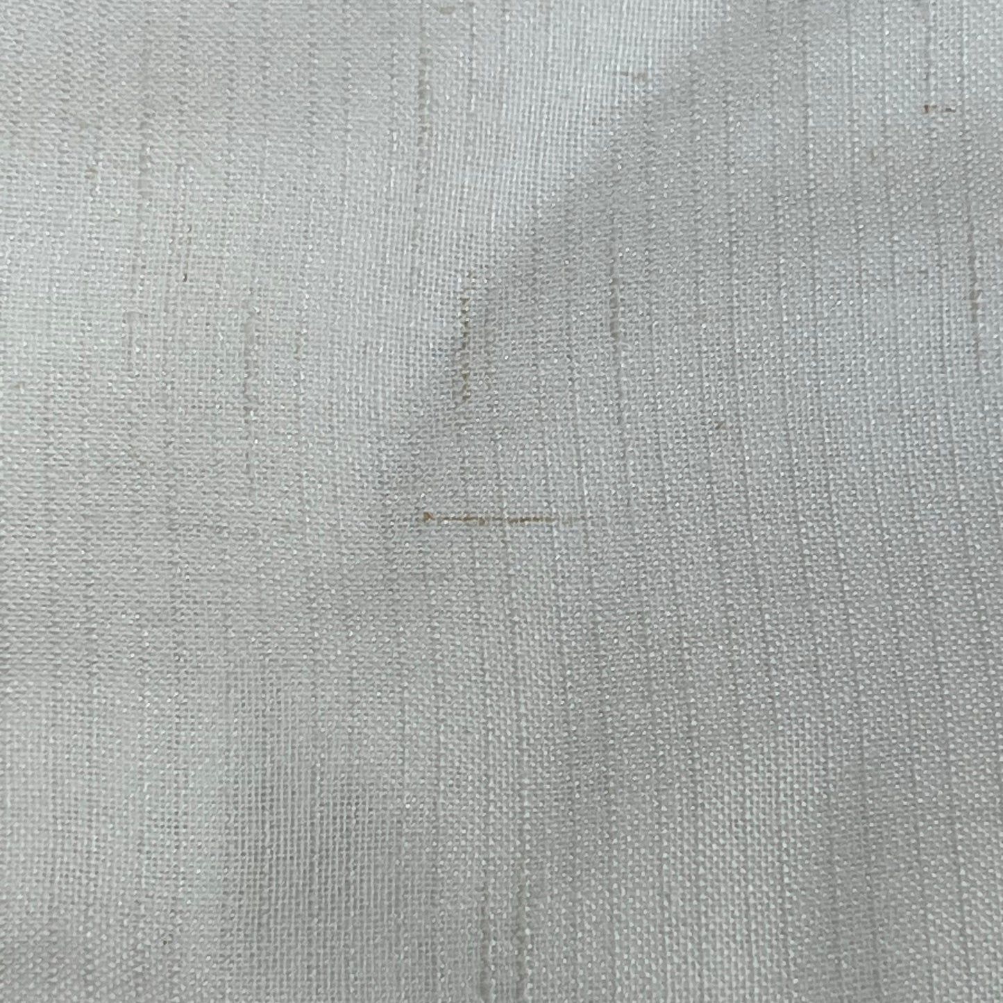 Close-up of Jinchan off-white linen blend fabric, showcasing the textured weave and light filtering quality of the curtains.