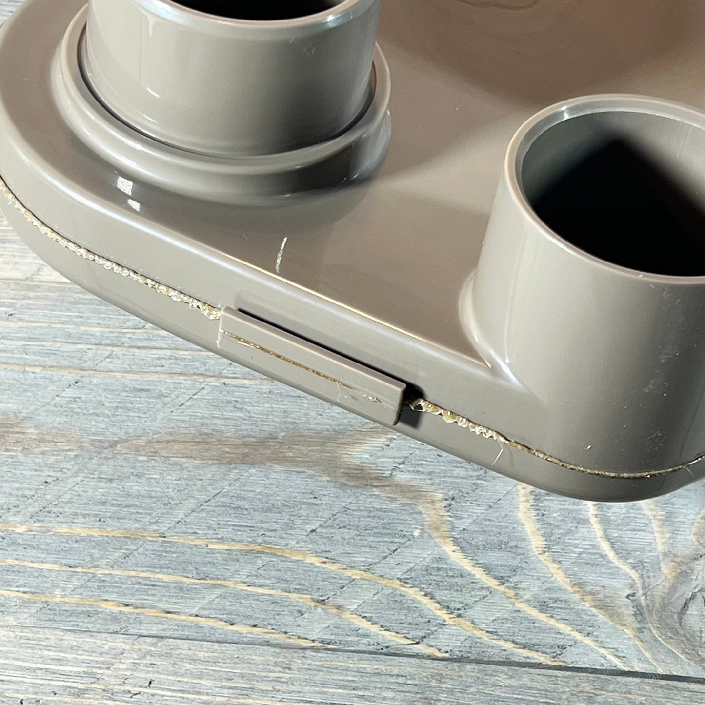 Close-up of a top manifold replacement for Hayward Swim Clear cartridge filter on a wooden surface.