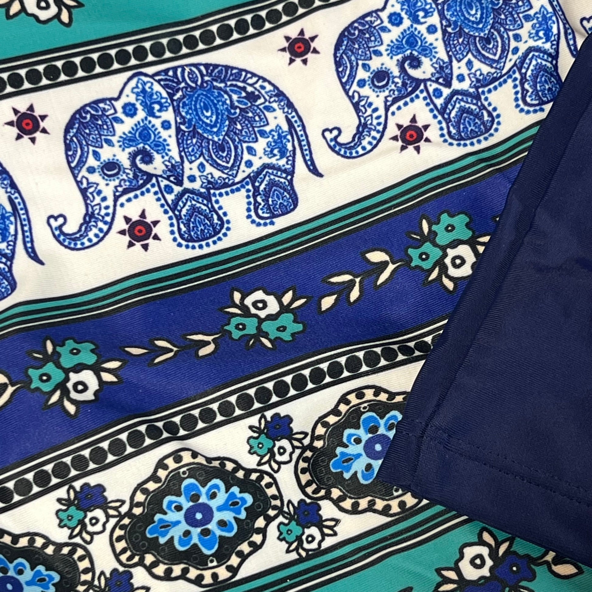 Close-up of blue mandala and elephant pattern on Yonique tankini swimsuit with shorts, size L.