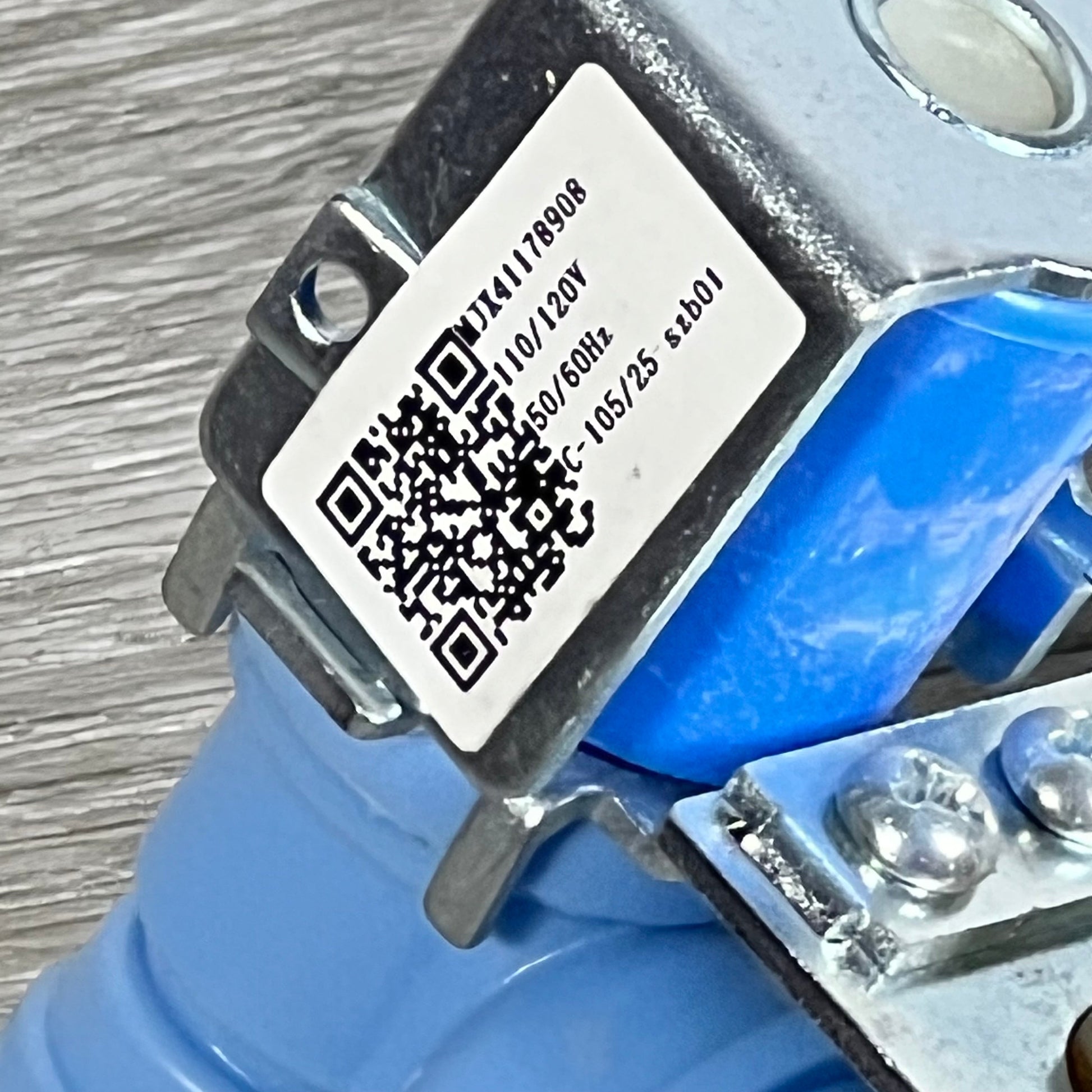 Close-up of BlueStars MJX41178908 water inlet valve for LG and Kenmore refrigerators, showing QR code and specifications.
