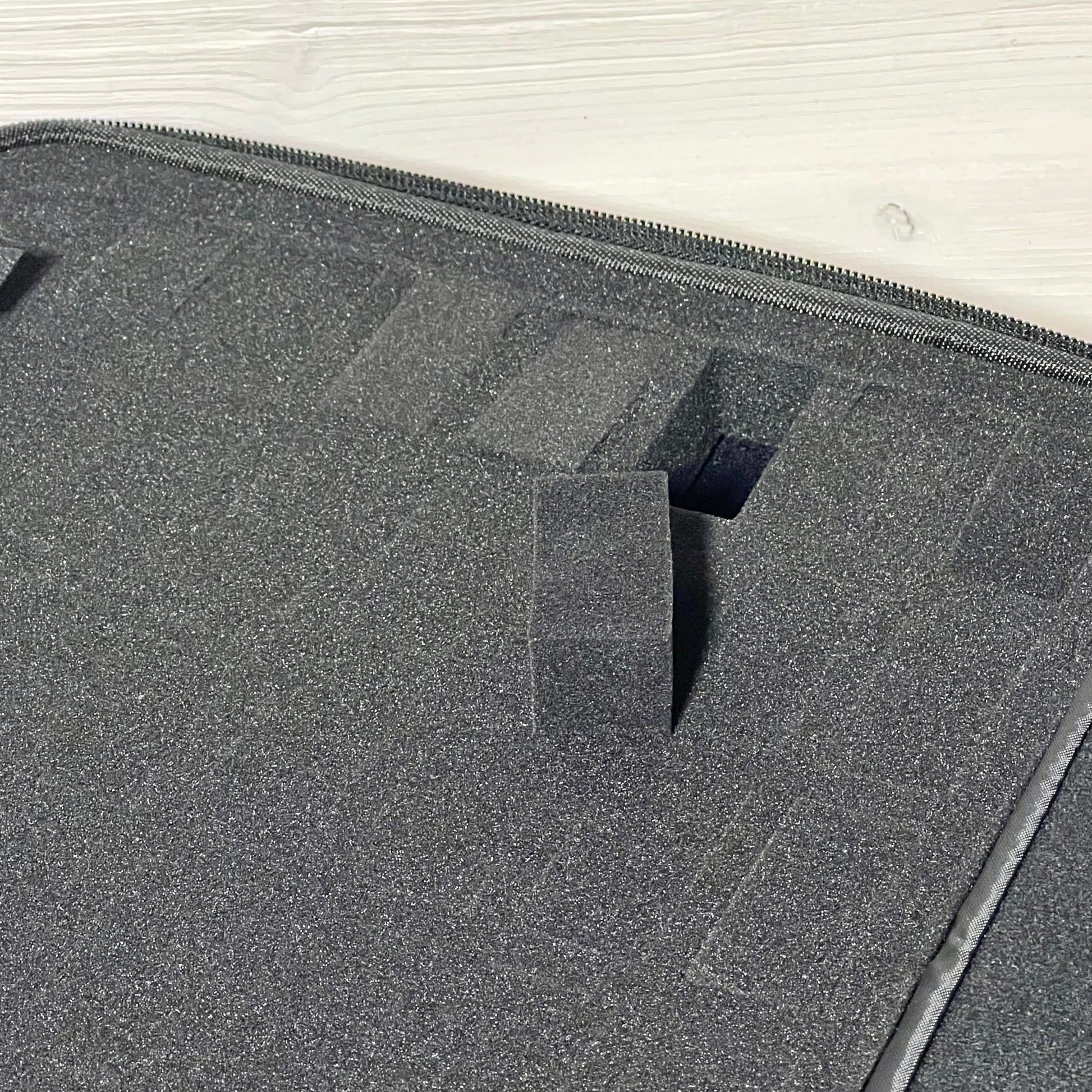 Close-up of Brappo Miniature Storage Case showing customizable pre-cut sponge slots for secure figure storage.