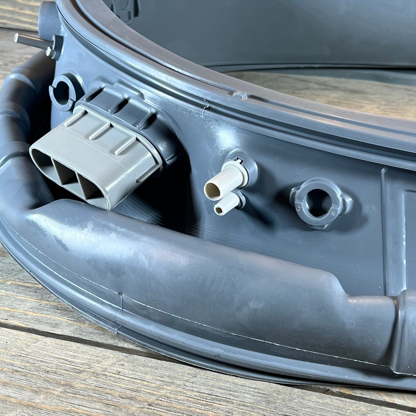 Close-up of DC97-18094B Door Boot Gasket, showing durable material and fittings for Samsung front load washer.