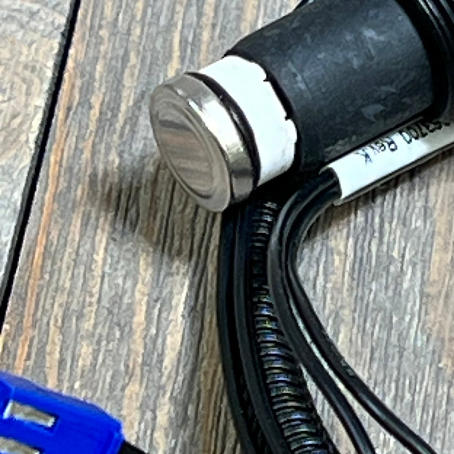 Close-up of Hihitomorrow R0457400 wire harness assembly for Zodiac Jandy heaters on a wooden surface.