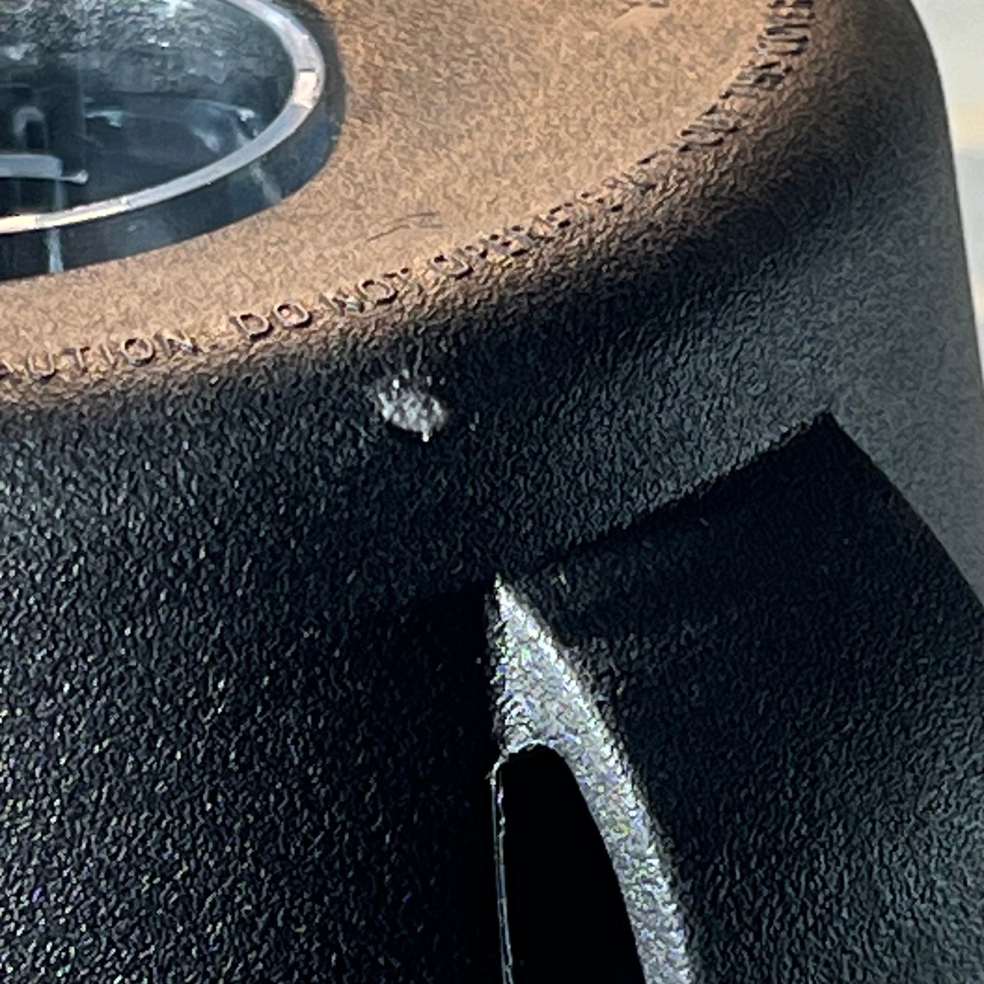 Close-up of textured black base of 64oz replacement blender pitcher for Vitamix 5200 series.