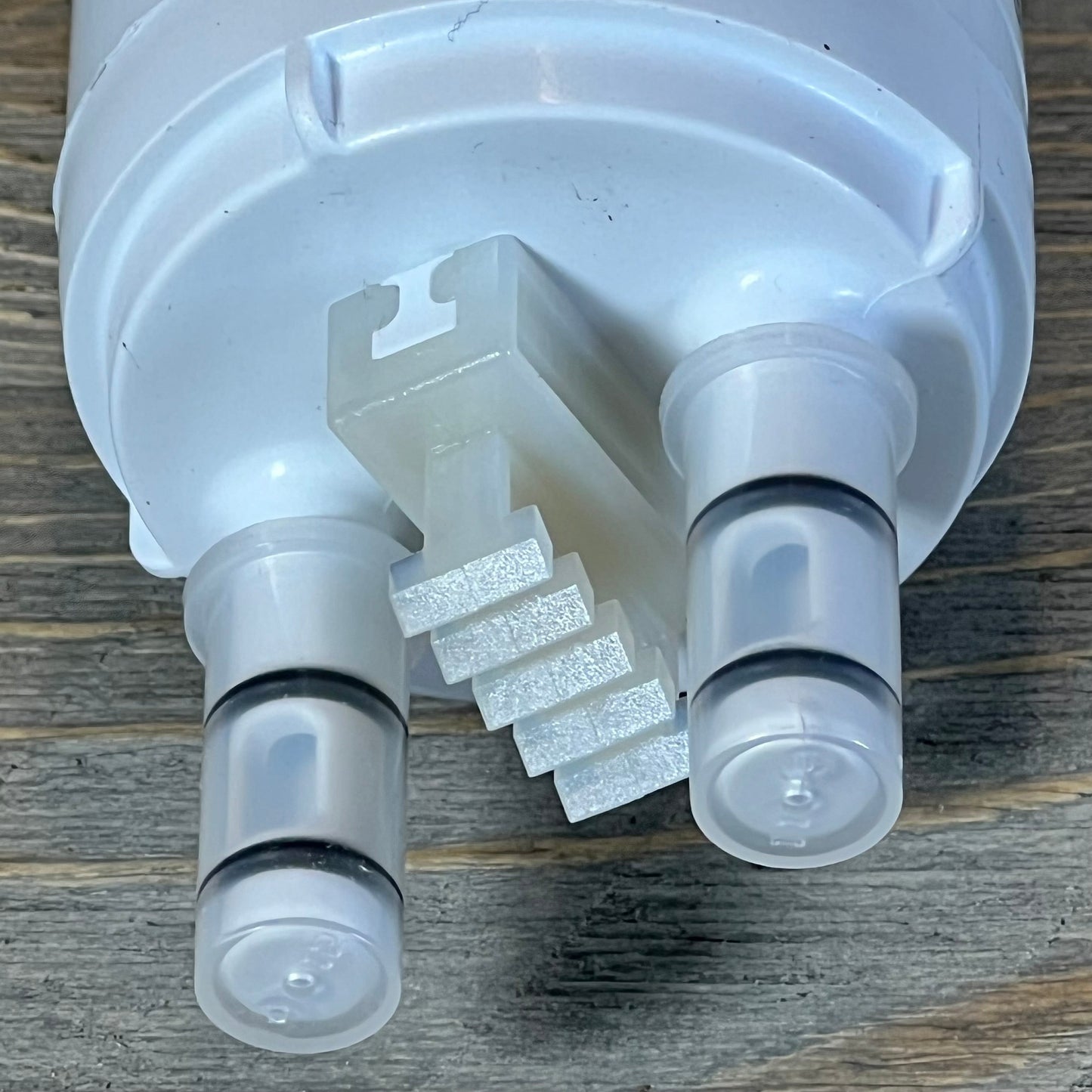 Close-up of the Frigidaire WF3CB water filter cartridge showing connection points and design details.