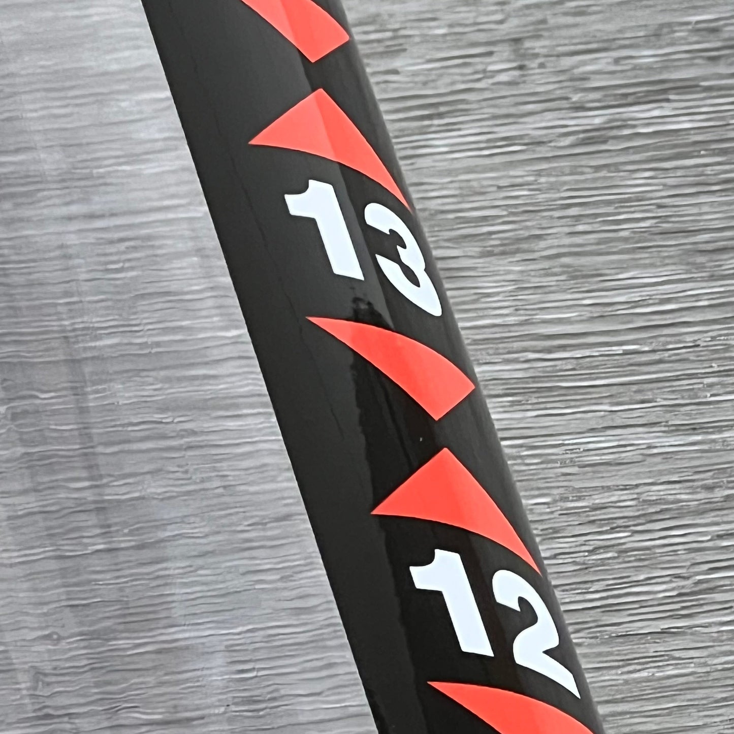 Close-up of the golf ball retriever tool's measuring marks on the 36-inch plastic tube.