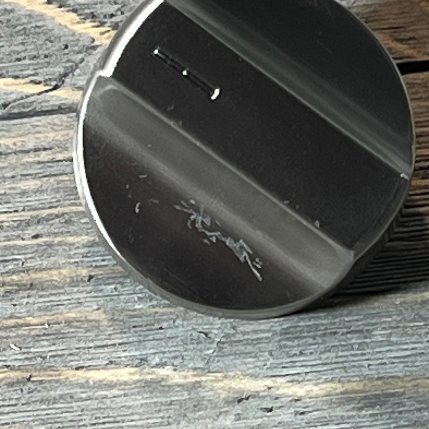 Close-up view of a stainless steel stove knob replacement for Whirlpool gas ranges, showcasing its durable finish.
