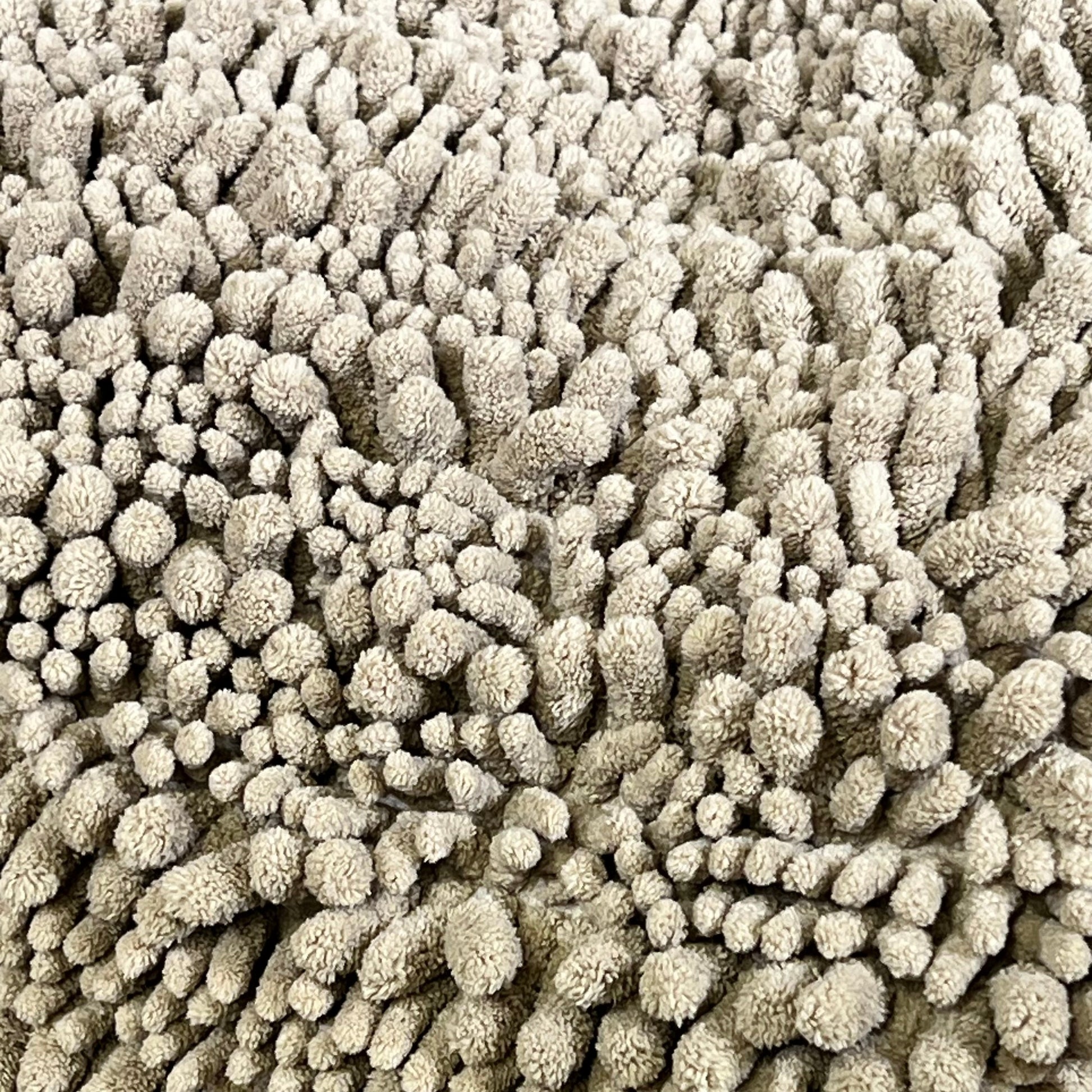 Soft, thick microfiber chenille texture of Yimobra bath mat in pale khaki, perfect for bathroom comfort and style.