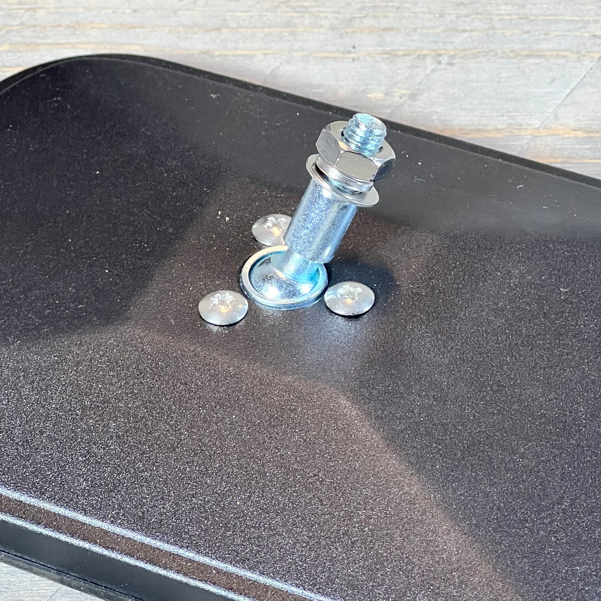 Close-up view of mounting hardware on anti-shake door off mirror for Jeep Wrangler JK JL & Unlimited.