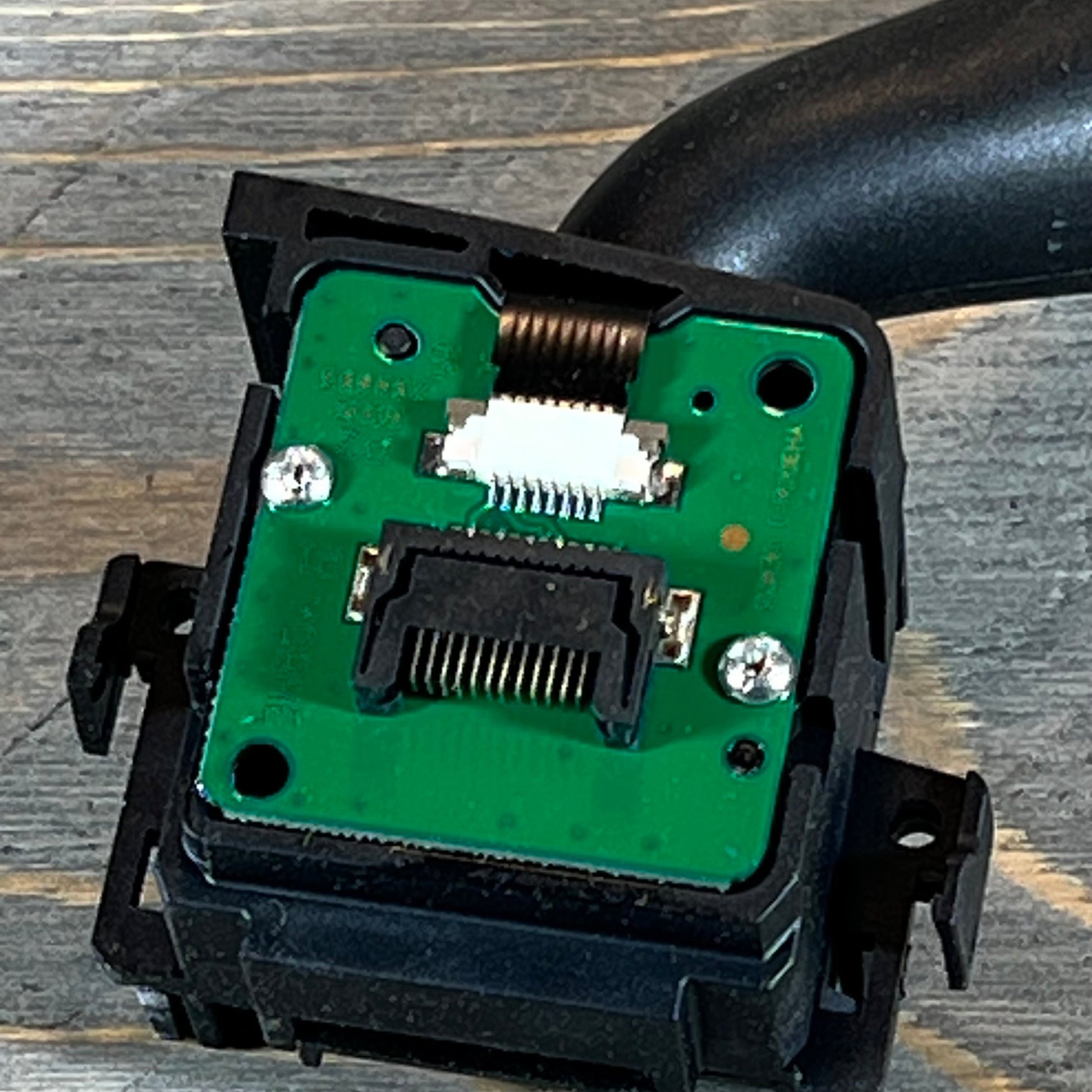 Close-up view of the circuit board on the windshield wiper switch for Ford Explorer, Edge, Lincoln MKX.