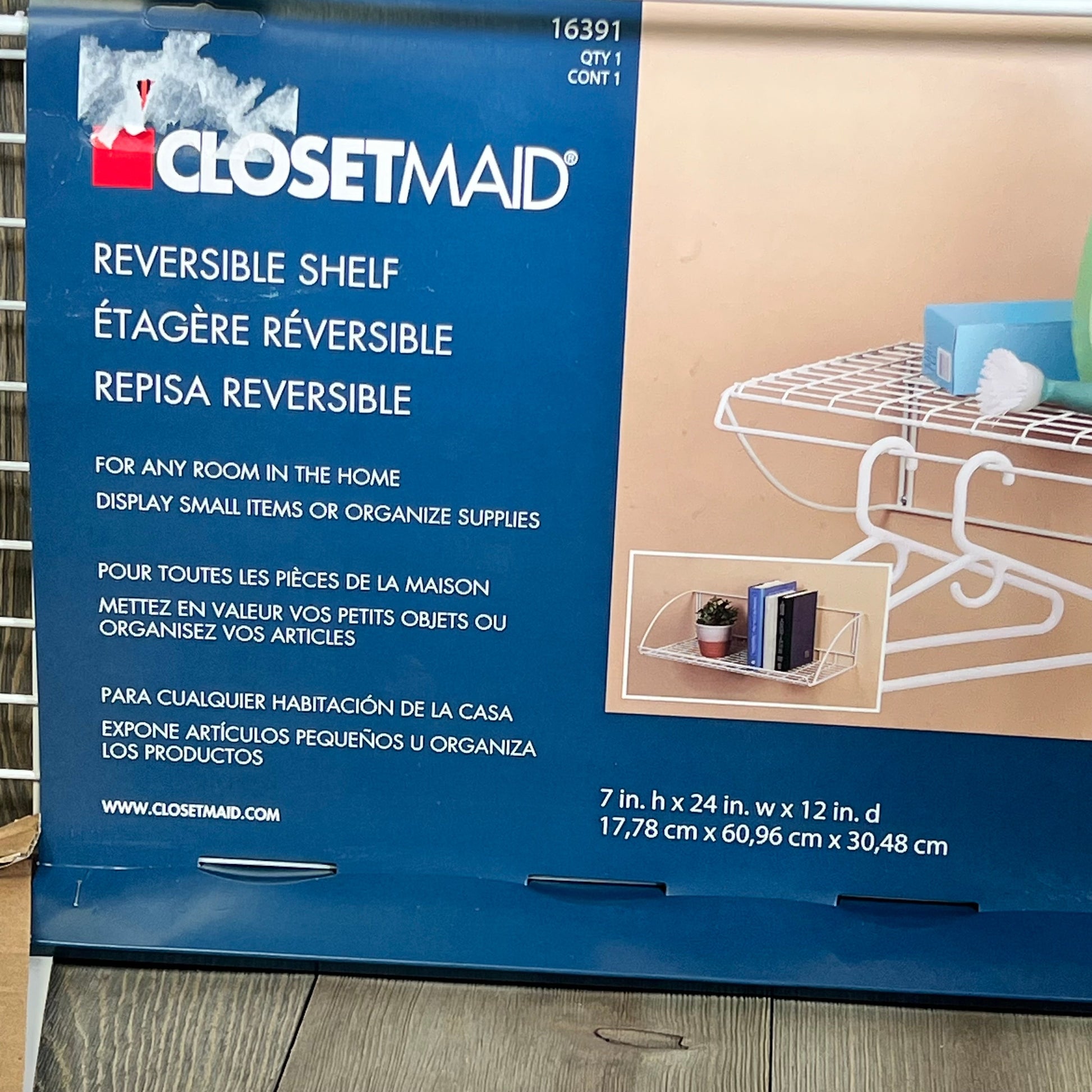 ClosetMaid 8279 24-Inch white utility hanger shelf packaging, showcasing reversible shelf design for versatile home storage.