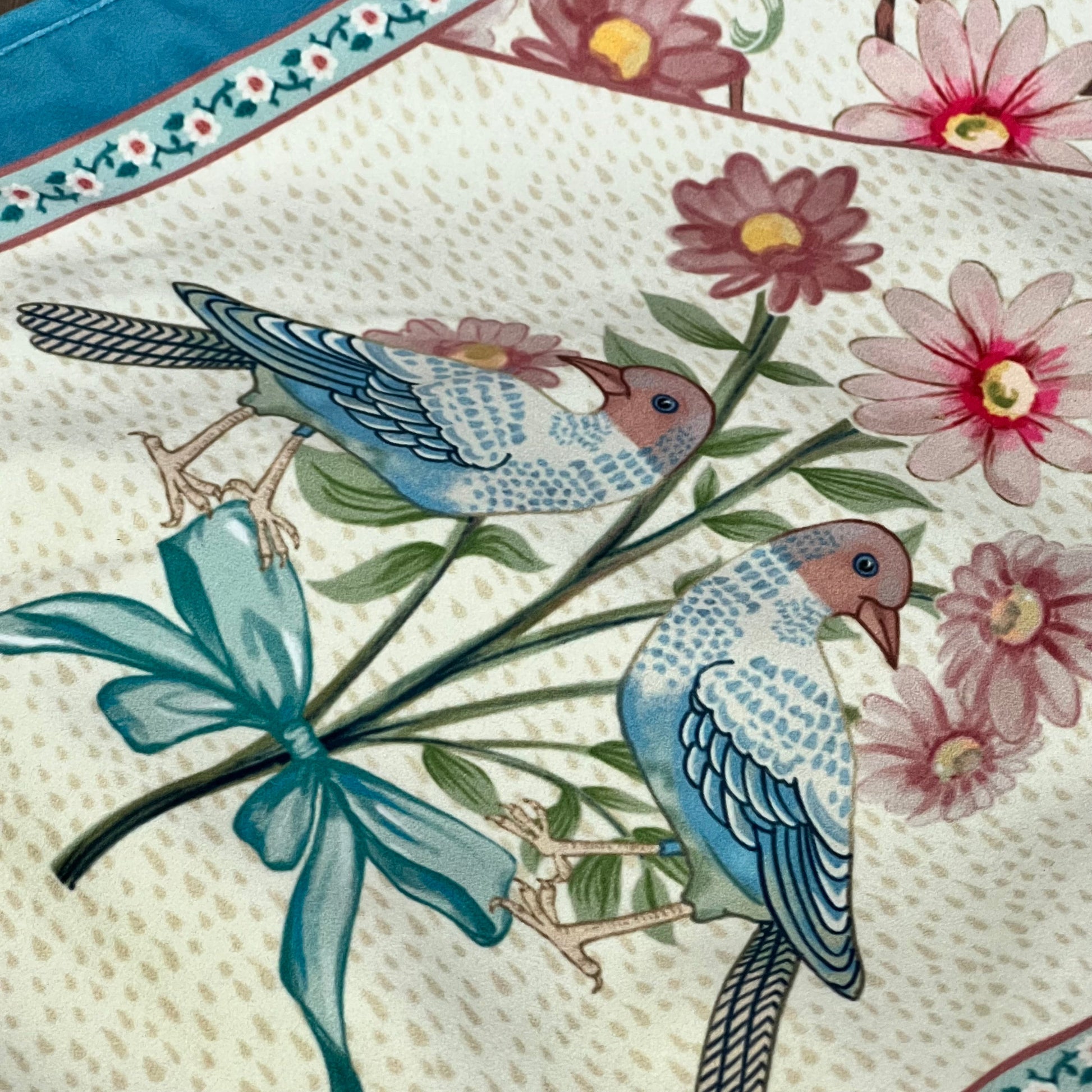 Elegant velvet table runner with blue birds and pink wildflowers, perfect for dining table decor.