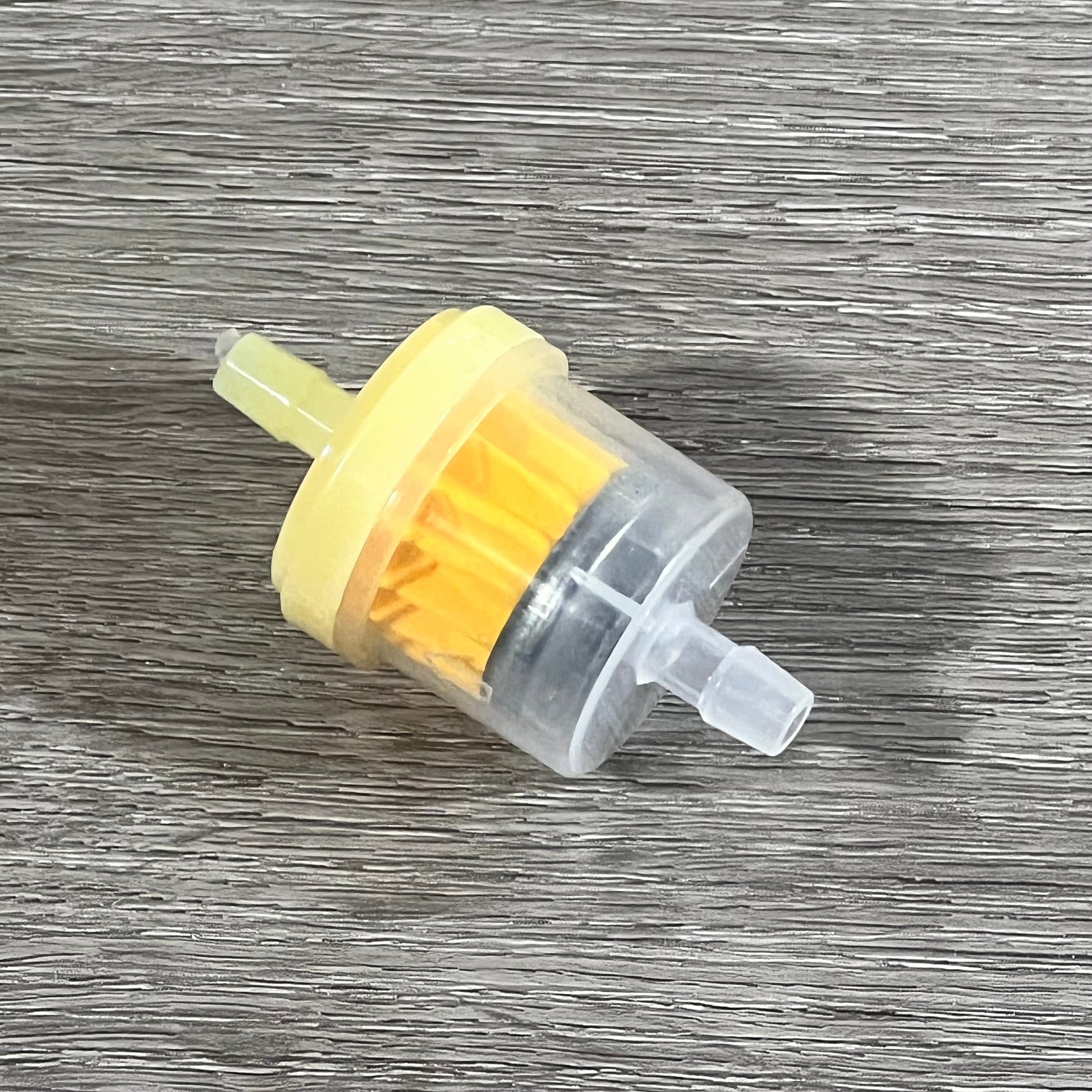 Compact Cylinman carburetor for John Deere mowers, showcasing durable design and precise engineering.