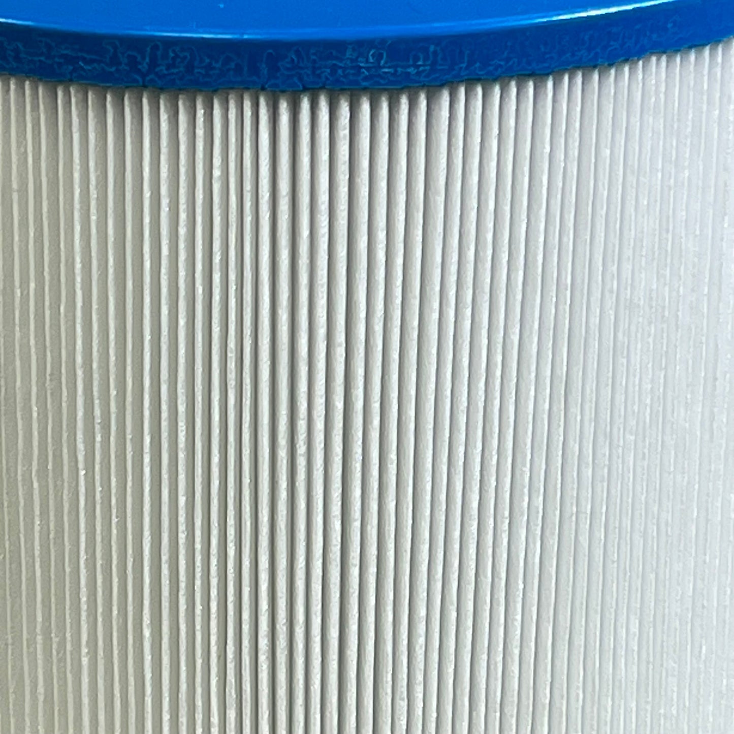 Close-up of 1047345716-8CH-950 spa filter cartridge pleats with blue rim, perfect for Bullfrog spa and 50 sq.ft. filtration.