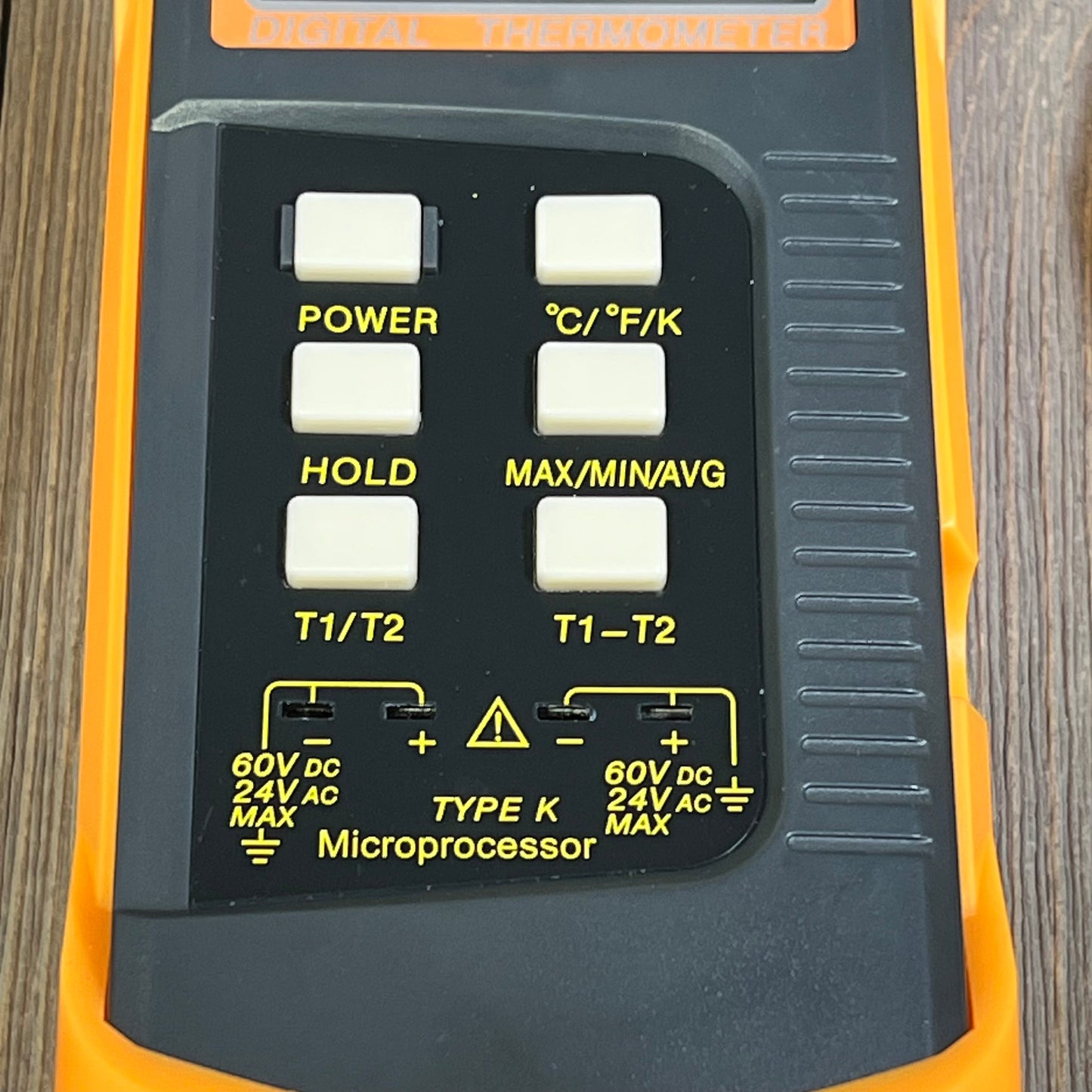 Dual-channel digital thermometer with control buttons for K Type thermocouple, featuring °C/°F/K options and accuracy settings.