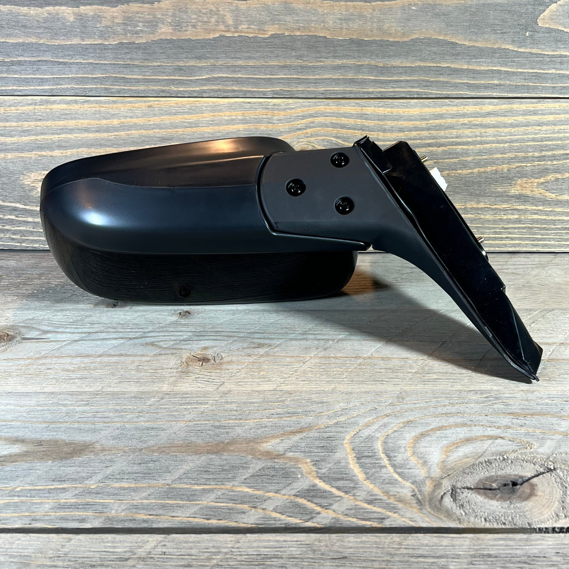 Driver side power mirror for 2003-2007 Honda Accord Coupe in gloss black, non-heated, side view angle.